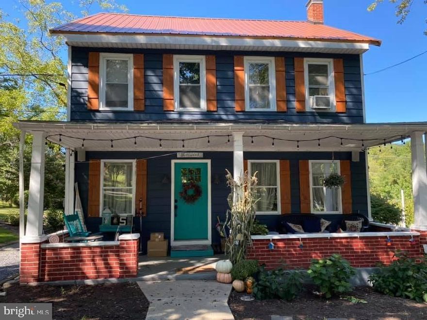 This charming traditional home, built in 1890, blends classic character with modern comforts. Step inside to discover a warm and inviting interior featuring wood floors and a cozy gas fireplace, perfect for gathering with loved ones. The spacious dining room is ideal for hosting dinner parties, while the kitchen boasts essential appliances, including a built-in microwave, dishwasher, and gas range, making meal preparation a delight. With four generous bedrooms and two full bathrooms, this home offers ample space for relaxation and privacy. Enjoy the convenience of a laundry area located in the basement, providing easy access while keeping your living spaces tidy. Replacement windows throughout enhance energy efficiency and natural light. Outside, the expansive 0.93-acre lot is a true retreat, featuring beautiful landscaping and a rear yard perfect for outdoor activities. An above-ground pool invites you to cool off on warm days, while the deck provides a lovely space for relaxing. Additional exterior features include an outbuilding for storage and an outside shower for post-pool refreshment. Parking is easy with a stone driveway and a detached carport. This home is not just a place to live; it's a sanctuary where memories are made. Experience the perfect blend of comfort, style, and outdoor enjoyment in this delightful property while enjoying an easy and quick drive to shopping, dining and work!