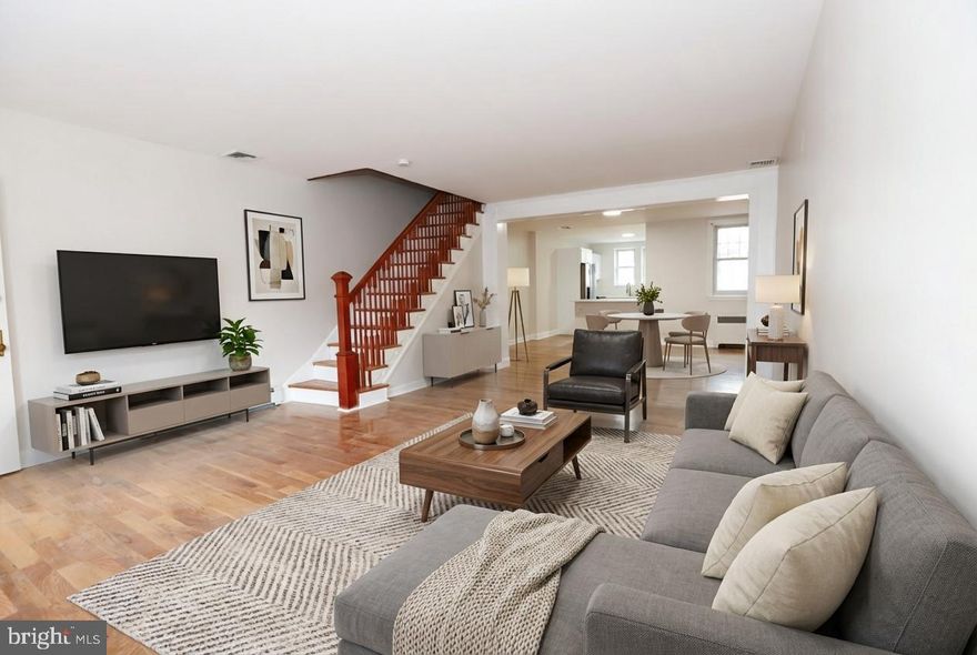 Welcome to this beautifully maintained interior row home in Northeast Philadelphia, offering classic curb appeal with a timeless stone exterior, plus the convenience of a private driveway and attached rear garage. This spacious home features 3 bedrooms and 2 full bathrooms, along with a fully finished basement designed for both comfort and entertaining.  Step inside to a large, inviting living room highlighted by brand new hardwood floors that extend throughout the first floor. The dedicated dining room provides the perfect setting for gatherings and flows seamlessly into the renovated kitchen, complete with stone countertops, stainless steel appliances, island facing the dining room, and ample cabinet space. Just off the kitchen, enjoy a private balcony facing the rear of the home.  Upstairs, you’ll find three generously sized bedrooms with great natural light and closet space. The full hall bathroom offers both a stand-up shower and a separate soaking tub for added comfort and flexibility.  The fully finished basement expands your living space with a built-in bar, ideal for entertaining, along with a second full bathroom featuring a jacuzzi tub and a separate laundry room for added convenience.  With driveway parking and a rear garage, this home combines functionality, style, and location — all in a desirable Northeast Philadelphia neighborhood. Don’t miss the opportunity to make this move-in-ready home your own!