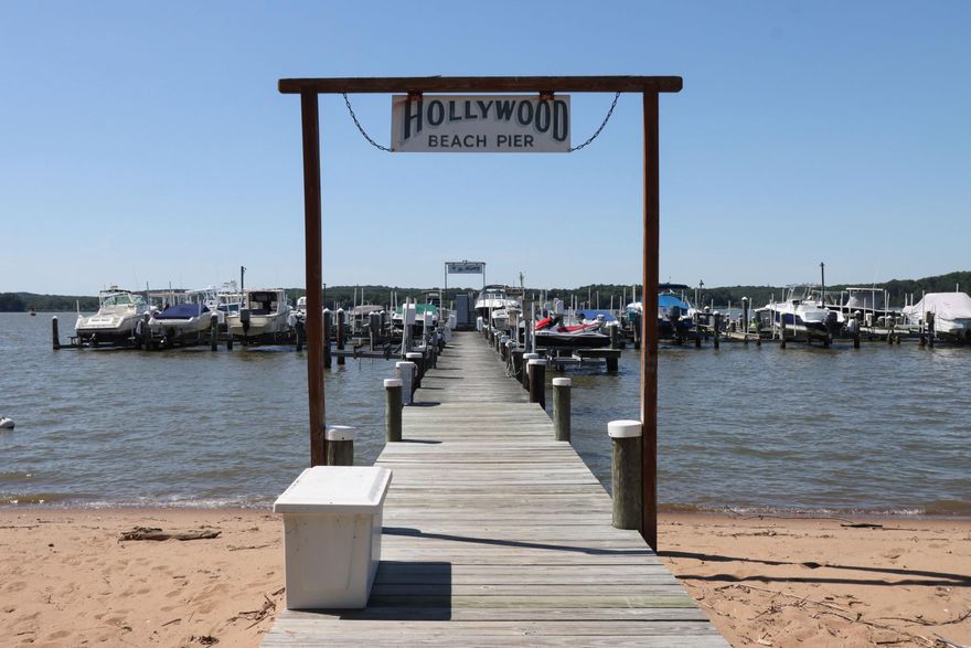 For boaters who don’t want the waterfront price tag…this is it! Just steps to the community pier - No Trailer, No Hassle. Pier expansion is about to begin. Welcome to life in Hollywood Beach - where every day feels like a getaway. This beautifully maintained two-bedroom two-bath home offers the perfect blend of comfort, updates and coastal lifestyle. Inside you’ll find an updated kitchen designed for both everyday living and easy entertaining, spacious bedrooms, and a fantastic sunroom with natural light; the perfect spot for morning coffee or relaxing after a day on the water. Step outside to a generous deck overlooking a wide usable lot ideal for summer gatherings, gardening, or simply enjoying the peaceful setting. The oversized two-car garage provides exceptional storage for vehicles, kayaks, paddle boards, fishing gear, and all your water toys. Located just steps to the water in the sought after water privileged community, residents enjoy easy access to a clubhouse, sandy beach, two parks and a community pier posting 37 slips with lifts (for an additional fee). Whether you’re boating, fishing or crabbing on the upper Chesapeake Bay, this is truly a boaters paradise perfect as a weekend retreat or a full-time residence This home offers a rare opportunity to enjoy the best of Chesapeake Bay living without the waterfront price tag.