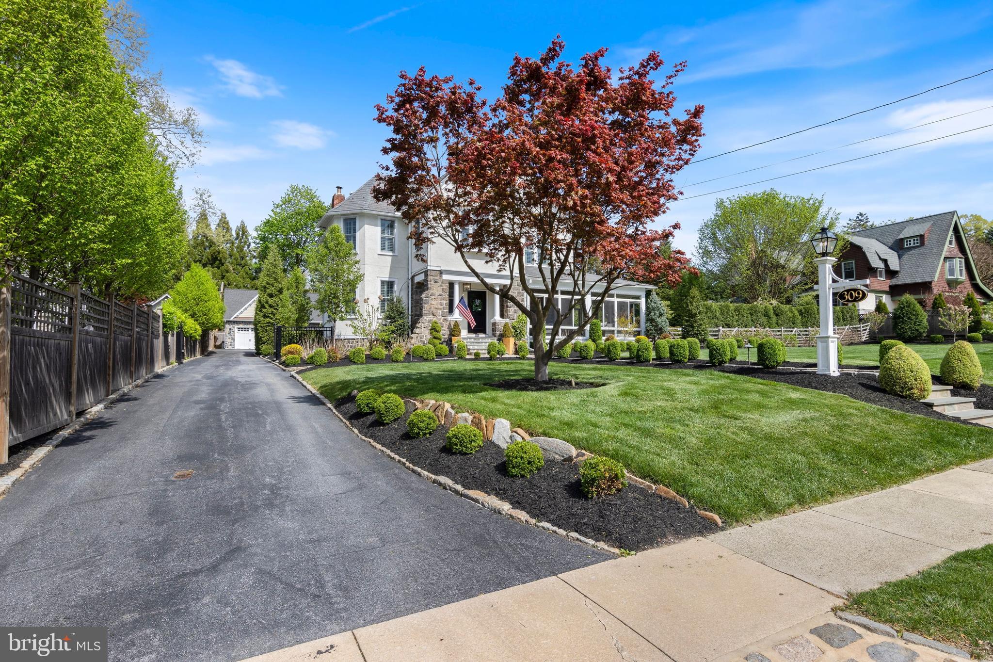 Stunning South Wayne home! Updates and amenities abound in this beautifully renovated walk-to-Wayne home nestled on a spacious, professionally landscaped lot. From the sidewalk-
lined street and newly paved driveway, dual stone pathways lead to a stately front
porch. Inside you’ll find hardwood floors, high-end window treatments (including
plantation shutters) and neutral paint throughout, plus custom moldings, designer
lighting and oversize, deep-silled windows. The foyer opens to a light and airy
family room that boasts a high ceilings and large windows with direct access to an enclosed,
wraparound glass sun porch with separate areas for lounging and casual gatherings.
Back inside, the family room connects to a sparkling kitchen and dining area that
spans the entire width of the home. From the tasteful white cabinetry and high-end
appliances to the peninsula seating and backyard views, this area makes hosting
and meal prep a breeze. A first-floor den/home office, mudroom and secondary
rear staircase complete this amenity-rich main level. Upstairs sits a glorious
primary suite with plantation shutters, walk-in closet designed by California
Closets and ensuite full bath with soaking tub and frameless glass shower. This
level also boasts two additional bedrooms, a renovated hall bath and a home office.
More space awaits on the third floor, where you’ll find two large bedrooms and a
full bath. The finished basement includes an open area for entertaining and play,
along with a temperature-controlled wine cellar and generously sized laundry room
with sink, ample cabinetry and storage area accessed via custom barn door.
Outside, the current owners spared no expense creating a South Wayne oasis
complete with a pool and hot tub encircled by a gorgeous travertine patio, plus a
high-end Wi-Fi/sound system and mature trees and plantings for maximum
privacy. Just beyond, you’ll find recently rebuilt new two-car garage with a charging
station and finished , temperature controlled second level that includes roughed-in plumbing for possible
conversion to a bedroom suite. Downtown Wayne is just a short sidewalk stroll
away, along with SEPTA rail, major commuter routes and award-winning Radnor
schools! Don't miss your opportunity today! OFFERS DUE SATURDAY, APRIL 22ND 5PM. PLEASE SEE PRESENTATION OF OFFERS FOR MORE INFO.