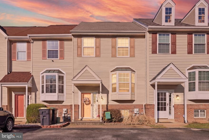 Welcome to this roomy townhome in the highly desirable community of Pine Woods  — where comfort, convenience to area shopping, and opportunity unite! Featuring 2 spacious bedrooms and 1.5 baths, this home offers a bright, open main level, with beautiful hardwood flooring throughout the main level, carpeted 2nd floor and basement level, and is move-in ready for both everyday living and easy entertaining. The spacious living area flows effortlessly into the kitchen and with a breakfast area in front of the bay window. A convenient main-level half bath adds extra functionality for company. The second level boasts two nicely sized bedrooms and a full bath, offering a convenient space for everyone. The partially finished basement adds an extra room with a variety of possibilities:   a private guest suite, home office, gym, or additional lounging room — adding instant flexibility and value.  The unfinished portion of the basement is located behind a door from the finished portion and allows ample storage space, and even has an exterior exit door to the rear yard.  The rear of the home is the surprising touch here with a 2 tiered wooden deck, perfect for spring and summer relaxing and entertaining! The awning bars and hardware are permanently attached to the deck and the custom canvas awning is professionally installed and removed each year for the season, overtop the wooden deck.  The wooden deck is beautifully maintained and was last power-washed & high quality deck paint was applied in August 2025. The rear of the home was also power-washed in August 2025 and is beautifully maintained.  The view from the deck are tall pine trees that whisper in the breeze! Located in the Christina School District and just minutes from major highways, shopping, dining, and everyday conveniences, this home offers the perfect blend of suburban comfort and commuter-friendly access. Whether you’re a first-time buyer, looking for room to grow, an empty-nester, or an investment property, this one fits the criteria — and the potential makes it even more exciting!  Don’t miss your chance to make this home yours!
(*Owner is having old child's playset and outdoor grill removed prior to settlement.)