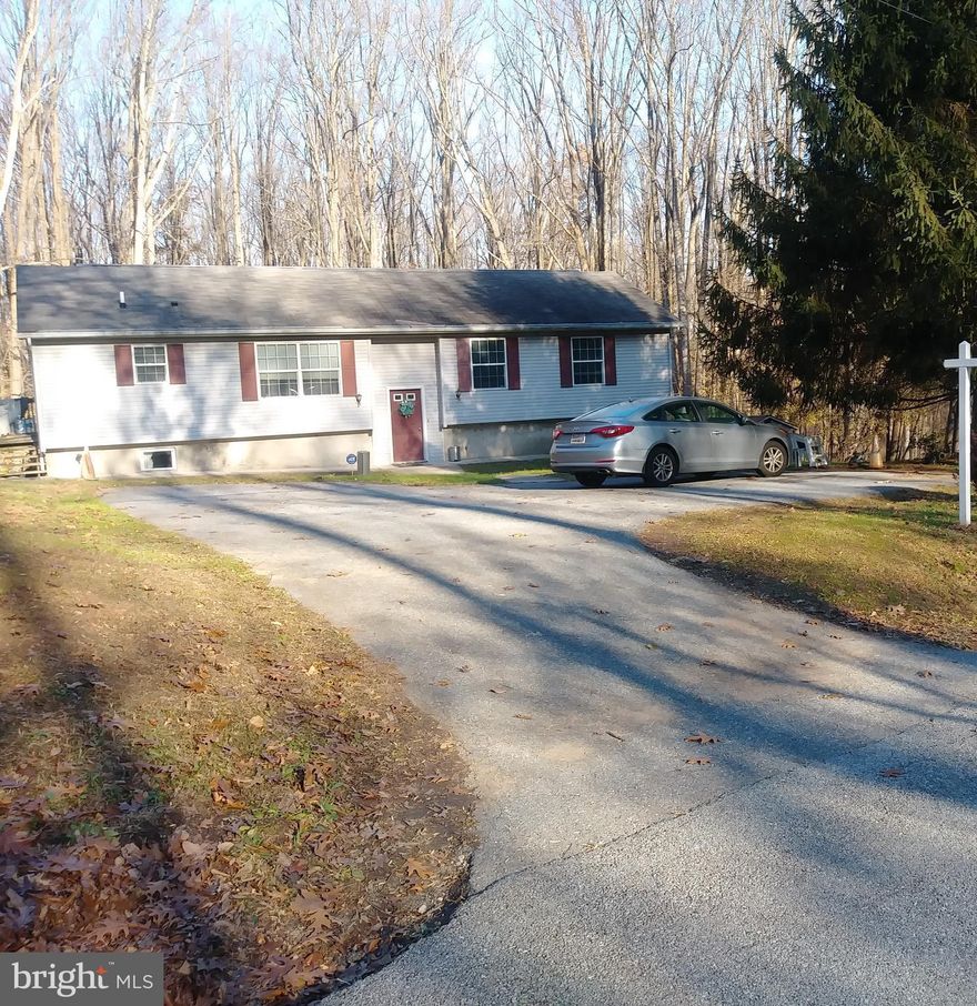 Hereford Schools zoned, 3BR/3BA Split-level foyer, one owner nested on 2+ acres, re-built 2001, hrwd flooring living/dining/steps, family area off kit with sliders leading to sizeable deck w/ beautiful nature views,  and huge backyard , close to Gunpowder State Park, laundry main level, two finished bonus rooms located lower level (could be 4th/5th BR/ Office) with more space for additional family rm,  man-cave or whatever you desire, 5 minutes to l-83, park n ride,  York Rd.,  as well as, shopping, dining, and a whole lot more. Closing assistance is available