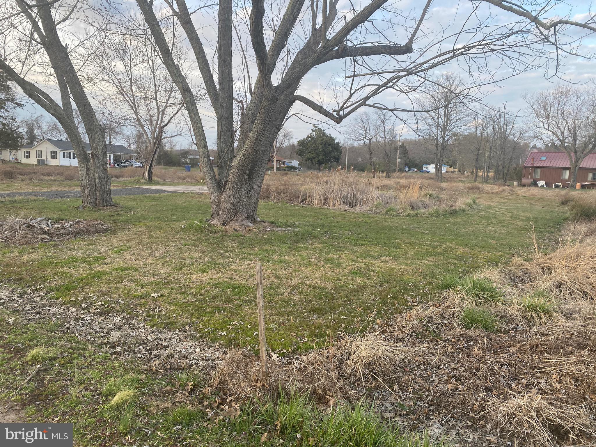 Level lot located in a waterfront community, foot print from prior home still exists on the lot, there was once an existing well and septic.