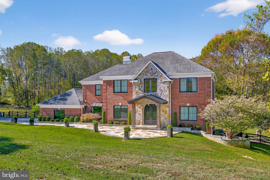 Introducing a breathtaking estate that has undergone a comprehensive renovation, with significant financial investment poured into every detail. This home showcases an exquisite transformation, where no expenses were spared.  A grand, curved bluestone patio and custom double glass front door usher you into over 7,500 square feet of luxurious finished living space (Pool house included). The stunning two-story foyer features travertine tile flooring with a custom emblem, an impressive staircase with a custom banister, and exquisite molding throughout every room.  

Main-level living is defined by architectural elegance at every turn, including triple crown moldings, chair rails, wainscoting, 8-foot doorways, oversized windows, and custom window treatments. Host elegant dinner parties in the dining room, with boasts travertine flooring and ornate moldings, or unwind in the expansive study equipped with a built-in desk/workstation and ample cabinetry. The family room offers panoramic views of the backyard and features a wood-burning fireplace set within a floor-to-ceiling stone hearth, along with a stylish built-in with custom lighting. 

The gourmet kitchen is every chef's dream, showcasing custom cabinetry enhanced by elegant up-lighting. It includes a Monogram range hood, Monogram gas range, double ovens, quartz countertops, two sinks, a wine fridge, skylights, a cathedral ceiling, and a large breakfast bar. The kitchen also features a cozy breakfast area and a wall of windows. The final, most desirable area to relax in is the incredible living room—perfect for reading or enjoying a quiet moment. 

The main level also includes a full bath, a laundry room with marble countertops, multiple closets with custom shelving, and access to the back deck. The master suite is designed for privacy, featuring a custom paneled wall with an electric fireplace and beautiful views of the backyard. A step down leads to the luxurious primary bath, which boasts a massive walk-in closet with custom shelving, a shoe holder, and lighting. The exquisite private bath is complete with natural stone flooring, dual shower fixtures, dual vanities, a jetted heated tub, and a second laundry area with storage. 
 
Soaring ceilings continue into the upper level, accommodating three generous bedrooms, a Jack and Jill bathroom, and an en-suite bedroom, with custom closets. The lower level offers a spacious recreation room that spans the length of the home, complete with a fully equipped bar featuring a sink and refrigerator. The oversized gym is exceptional, while additional spaces include a playroom with ample shelving, a utility room with two water heaters, a water filtration system, and radon mitigation systems.  

The heart of the lower level is the impressive home theater room, equipped with a projector, screen, custom lighting, and surround sound. The sixth bedroom features a walk-in closet and a private full bath with an oversized shower and built-in bench seating. In the basement, you’ll find and a spacious covered walk-out level—a true retreat featuring a luxurious Jacuzzi, perfect for guests to unwind while taking in the gorgeous views.  

Outside, the meticulously landscaped grounds are an entertainer’s dream. The composite deck overlooks travertine tile and bluestone surrounding a heated, saltwater in-ground pool. The poolside area is the perfect retreat, featuring a gorgeous pergola, kitchen and breakfast bar with a pizza oven, a stone outdoor fireplace, a large dining area, and an incredible pool house that includes the seventh full bath. The 3-car garage offers ample storage space, a 220V electric charger, and a side entrance for easy access.  

The professional landscaping, custom entry gate, and hardscaping rival the exquisite details in the home including a large retaining wall, ample parking, a playground/house, a garden, fully fenced backyard, and newly installed $50,000 generator that can power the entire home for a full week or more!