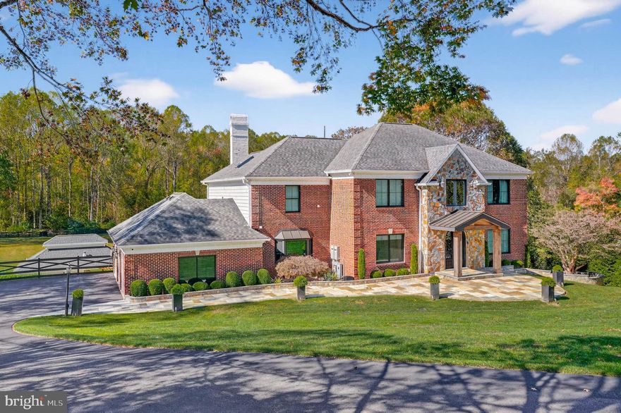 Welcome to this magnificent stone and brick residence located in the highly sought-after Highland area. A grand, curved bluestone patio and a custom double glass front door usher you into over 7,500 square feet of luxurious finished living space. (including pool house) The stunning two-story foyer features travertine tile flooring with a custom emblem, an impressive staircase with a custom banister, and exquisite molding throughout every room. 

Main-level living is defined by architectural elegance at every turn, including triple crown moldings, chair rails, wainscoting, eight-foot doorways, oversized windows, and custom window treatments. Host elegant dinner parties in the dining room, which boasts travertine flooring and ornate moldings, or unwind in the expansive study equipped with a built-in desk, workstation, and ample cabinetry. The family room, adorned with travertine flooring, offers panoramic views of the backyard and features a wood-burning fireplace set within a floor-to-ceiling stone hearth, along with a stylish built-in with custom lighting.

The gourmet kitchen is every chef's dream, showcasing custom cabinetry enhanced by elegant up-lighting. It includes a Monogram range hood, Monogram gas range, double ovens, quartz countertops, two sinks, a wine fridge, skylights, a cathedral ceiling, and a large breakfast bar. The kitchen also features a cozy breakfast area and a wall of windows. The final, most desirable area to relax in is the incredible living room—perfect for reading or enjoying a quiet moment.

The main level also includes a full bath, a laundry room with marble countertops, multiple closets with custom shelving, and access to the back deck. The master suite is designed for privacy, featuring a custom paneled wall with an electric fireplace and beautiful views of the backyard. A step down leads to the luxurious primary bath, which boasts a massive walk-in closet with custom shelving, a shoe holder, and lighting—sure to impress. The exquisite private bath is complete with natural stone flooring, dual shower fixtures, dual vanities, a jetted heated tub, and a second laundry area with storage.

Soaring ceilings continue into the upper level, accommodating three generous bedrooms, a Jack and Jill bathroom, and an en-suite bedroom, all with custom closets. The lower level offers a spacious recreation room that spans the length of the home, complete with a fully equipped bar featuring a sink and refrigerator. The oversized gym is exceptional, while additional spaces include a playroom with ample shelving, a utility room with two water heaters, a water filtration system, and radon mitigation systems. 

The heart of the lower level is the home theater room, equipped with a projector, screen, custom lighting, and surround sound. The sixth bedroom features a walk-in closet and a private full bath with an oversized shower and built-in bench seating. On the other side of the basement, you’ll find the seventh full bath and a walk-out level—an ideal space for guests, complete with a hot tub and gorgeous views.

Outside, the meticulously landscaped grounds are an entertainer’s dream. The composite deck overlooks travertine tile and bluestone surrounding a heated, saltwater in-ground pool. The poolside area is the perfect retreat, featuring a gorgeous pergola, a kitchen and breakfast bar with a pizza oven, a stone outdoor fireplace, a large dining area, and an incredible pool house that includes the seventh full bath. The meticulously maintained three-car garage offers ample storage space, a 220V electric charger, and a side entrance for easy access. 

The professional landscaping, custom entry gate, and hardscaping rival the exquisite details found within the home, including a large retaining wall, ample parking, a playground, a garden, a fully fenced backyard, a playhouse with a ladder, and a generator that can power the entire home for a full week or more!