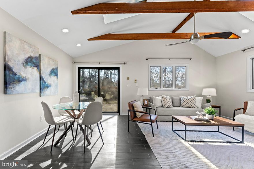 OPEN SUNDAY 12/17 10AM-12NOON.  Want something original and not cookie-cutter? Captivating 2-level Stonegate home on .38 acres with character abound where you can add your final customizations like new glass front doors, or garage where carport is, to transform home. You may opt to completely open up layout on main level too.  Four bedrooms, 2.5 bathrooms, this home features a spacious layout on nearly .5 acre of land. Enter the home through double doors into a grand 2-story space with exquisite chandelier. This room is made for entertaining as grand entry, formal dining room, gallery space. etc. To the left of the space is a bedroom with wood burning fireplace that can double as an office or living room. Follow the hall to the main level bathroom and into the kitchen. This recently renovated kitchen boasts a remarkable amount of storage (pantry included!), a large ceramic farmhouse sink, stainless appliances and room for a breakfast table. Off the kitchen is the heart of the home, a vaulted-ceiling family room with skylights and exposed wood beams. Light floods this room from all directions. The primary suite is upstairs and is also flooded with light with exposures on three sides. The ensuite bathroom features a double vanity and heated floor. Step outside to the deck and hot tub from the primary suite. Two more bedrooms with customized closets and a full hall bathroom are also found on the upper level. Complete kitchen remodel in 2018. New carpet and paint in 2023. Roof is 8 years old. Additional features include a 2-car carport, long driveway and attic space. Just minutes to HWY- ICC 200 (Toll), New Hampshire (RT 650) and Colesville Rd (US 29). Short drive to schools and shopping centers. Just 15 mins to Bethesda, 8 mins to Olney and 30 mins to Baltimore. Walk to Stonegate Swim Club.