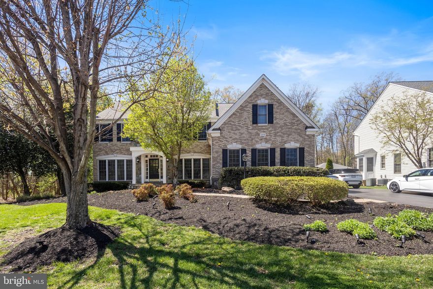 Introducing 22579 Forest Manor Dr — a beautifully appointed former model home set on a private, half-acre homesite in the prestigious Forest Manor community. Showcasing refined finishes, thoughtful upgrades, and exceptional indoor-outdoor living, this residence offers the perfect blend of elegance and comfort.

A grand two-story foyer with a striking wrought-iron staircase sets a sophisticated tone, leading to formal living and dining spaces designed for both entertaining and everyday luxury. A private study with custom built-ins provides an ideal work-from-home retreat, while the dramatic family room features soaring ceilings, expansive windows, and a warm fireplace that anchors the space.

The fully renovated gourmet kitchen is a chef’s dream, featuring modern cabinetry, granite countertops, stainless steel appliances, designer backsplash, and a spacious pantry. A stylish butler’s area with wine storage seamlessly connects the kitchen to the formal dining room. Just beyond, the sun-filled vaulted sunroom opens to a stunning outdoor oasis complete with an expansive deck, brick patio, outdoor fireplace, and built-in grill — perfect for elevated entertaining and relaxing evenings.

Upstairs, the luxurious primary suite offers a serene retreat with a private sitting area, custom walk-in closet, and a beautifully redesigned spa-inspired bath. A secondary en-suite bedroom provides additional comfort, while two generously sized bedrooms and a full bath complete the upper level.

The finished walk-up lower level is designed for lifestyle flexibility, featuring a spacious recreation room, dedicated theater space, full bath, workout room, and wet bar — ideal for entertaining guests or extended living.

Additional highlights include updated flooring, newly renovated bathrooms, fresh designer paint, LED lighting, and a newer upper-level HVAC system — ensuring both style and peace of mind.

This exceptional residence delivers timeless elegance, modern updates, and resort-style outdoor living in one of the area’s most desirable neighborhoods.
