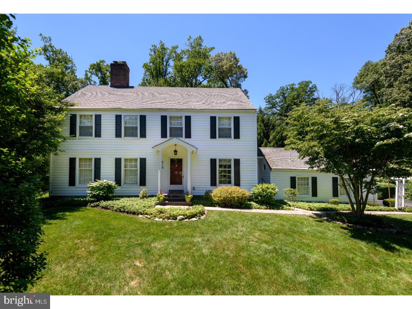 Welcome to 616 Jeffrey Lane, a fabulous four bedroom, two and a half bathroom center hall Colonial home nestled on a picturesque lot located on a quiet cul-de-sac in highly sought after Wayne. This immaculate home is a true gem and has been meticulously cared for both inside and out. Feel the the charm of this special home immediately as you enter the foyer showcasing lovely brick flooring. The foyer is flanked by the gracious formal living room featuring crown molding, a wood burning fireplace & built-in bookshelves and the lovely dining room, also with crown molding and chair rail. The wonderful eat-in-kitchen offers tons of cabinet and counter space and features exposed beams, beautiful hardwood flooring, raised panel cabinetry, tile backsplash, stainless steel appliances, large pantry closet, sliding glass doors leading to a huge deck out back and another door leading to the lovely flagstone walkway out front. The kitchen's dining area overlooks the deck and gorgeous landscaping. The massive family room features a floor to ceiling brick wood burning fireplace, built-in bookshelves, two large bay windows overlooking the beautiful grounds and a French door leading to the back deck. A laundry room with octagon window, nice powder room and access to the oversized two-car garage completes the picture for the main level. Upstairs you'll find the spacious master suite offering tremendous closet space and renovated bathroom with large tiled shower and flooring. Three additional nicely-sized bedrooms, a delightful hall bathroom with tile flooring and a huge walk-in closet complete the second level of this very special home. The lower level features a generously-sized finished space offering endless possibilities plus separate workbench and storage rooms. The grounds of this home are exquisite. Years of loving cultivation have created a true oasis and an ideal setting for outdoor dining, playing, entertaining or just relaxing. The yard up and to the left of the deck is the ideal place for a swing set and outdoor play. Two barn-style sheds with additional storage are incorporated into the park-like setting. Beautiful landscaping, newer siding, Pella and Anderson windows, gutter guards, great closet space and so much more all combine to create a magnificent place to call home. Minutes to downtown Wayne and KOP, Valley Forge Natl Park, corporate centers, Wegmans, Lifetime Fitness and public trans plus the #1 ranked Tredyffrin-Easttown School District. Welcome home!