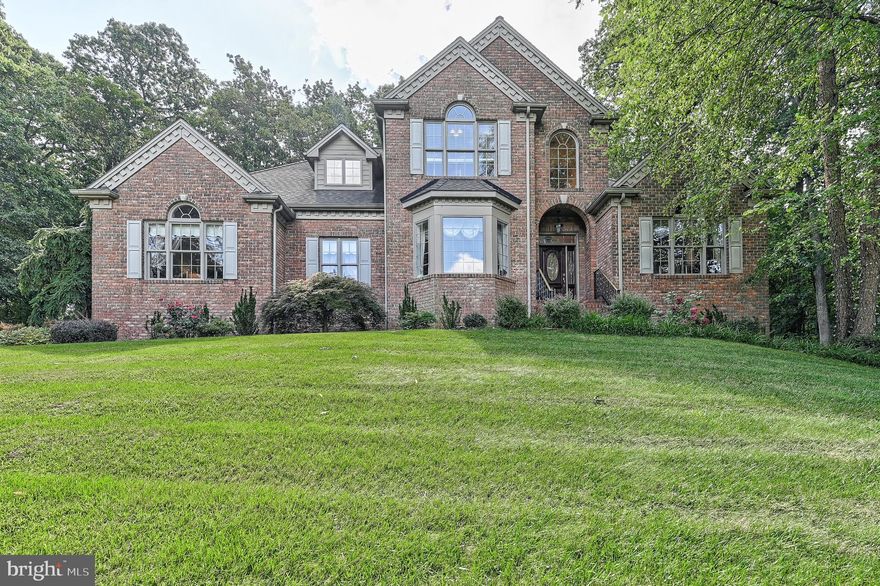 Seller says sell! In addition to a price reduction, seller is providing $5,000 to be used  towards closing cost or help with buyer buying down  their rate! Custom built home in New Freedom, minutes from 83, Private wooded lot on 0.92 acre. Primary first floor bedroom, with sitting area, large walk in closet and primary bath with jacuzzi tub and shower.  Oversized Side load 2 car garage. This home was built in 2003 and as you enter the front door and foyer area you will see the 2 story open staircase, there  is a a formal living room  and dining room in the front of the home, as you pass the staircase, you will walk into a stunning family room with floor to ceiling stone fireplace, the kitchen has plenty of cabinet space and island in the center. First floor laundry room with utility sink. 3 very nice size bedrooms upstairs with lots of storage and closet space.  The front bedroom has a rough-in for a full bathroom, which is currently a closet area. Finished lower level with ample sunlight, walkout basement and full bathroom and lots of space for storage in the unfinished area. Two zoned heating and air. Shed was built to match the style of the home. Enjoy quiet evenings on your brick  patio. Seller would love a quick closing!