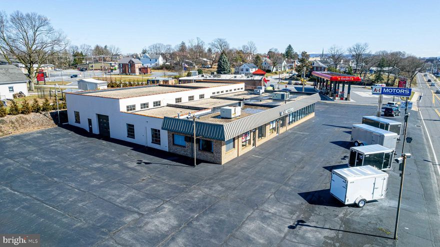 This well maintained commercial building is being now offered publicly for sale for the first time.  With over 10,000 square feet of usable space under roof, and over ONE ACRE in the Borough of Chambersburg - this property offers opportunity for a various assortment of ventures. Enjoy excellent exposure and a high traffic count. This property is conveniently located on a main artery.  Many uses possible - refer to zoning.  This custom built facility offers a mixture of office, meeting, retail/showroom, warehousing and workshop space. The rear workshop / warehouse offers three loading doors and 14 foot ceilings. The possibilities are endless.  Will your business be the next to thrive here?