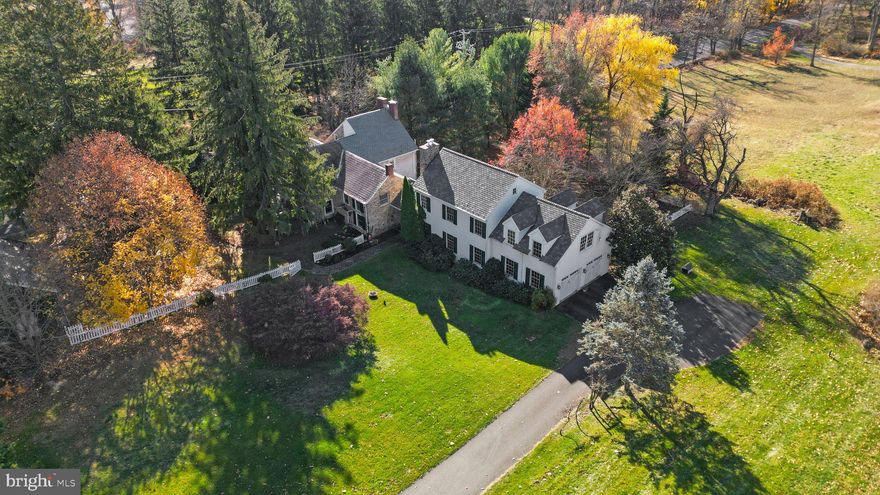 Introducing 4044 Mechanicsville Rd—a 1730's Farmhouse meets a gorgeous Modern professionally crafted 2004 addition that truly complement each other perfectly on 7.5 lush acres that exudes charm and elegance. 5 Bedrooms (2 of them Primary Bedrooms), A huge professional office space and 3.5 bathrooms overall.  This beautifully crafted home boasts a picturesque exterior with stone wall cladding, setting the stage for a remarkable property. Step inside through the huge double doors and you're greeted by a sense of grandeur. The kitchen features cherry wood cabinets, a kitchen peninsula, stainless steel appliances, and built in custom pantry. Enjoy your morning coffee in the breakfast nook overlooking the sprawling grounds. The main level offers a spacious living room, elegant oversized dining room with 2 (yes 2) fireplaces to entertain a large gathering of friends and family,  the 2004 custom renovation added a great room with a gas stone fireplace - perfect for cozy evenings.  This great room overlooks the  bluestone patio to enjoy the grounds and white picket fenced yard.  A convenient laundry room and beautiful guest bathroom completes this level. Upstairs, the primary private bedroom boasts a home office, walk-in closet, and a luxurious bath with his and her sinks, an enclosed shower, and a separate tub. The spacious office is large enough for a sitting room as well as an office with tons of storage.   4 additional bedrooms provide ample space for guests or a growing family. Downstairs, the basement offers a recreational room, wine room and bar area, and an utility room with a workshop.  This property features 7.5 tranquil acres of land, barns, corn cribs and a chicken coop, and extra garages maybe for a car enthusiast.  The Huge bank barn provides ample storage space and endless possibilities - I really mean endless possibilities. Gardens galore and a Koi pond as well.  2 Car attached garage and the additional oversized 2-car garage with a loft offers additional storage space and is currently used as a workshop. The Bank barn also has parking for an additional car if needed.  Honestly words can't describe this property - It is a MUST SEE!!!!!!Don't miss out on the opportunity to own this exceptional property. Schedule a showing today!