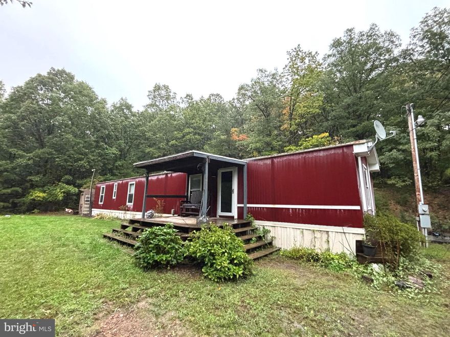 Single wide mobile home located on 3 acres surrounded by woods, but less than 5 miles from the Town of Bath. Mobile home is in good livable condition. Location is great for commuters being only minutes away from 522, close to both VA and MD line. Being sold AS-IS.