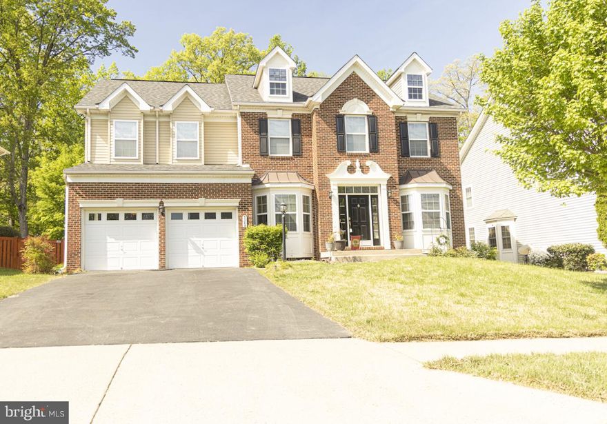 Rare Gem in Spriggs Run Estates! Take a look at this huge Lennar colonial backing to private woods! The biggest model in the neighborhood. With over 4,200 square feet, this home boasts a grand 2-level foyer, hardwood floors, 9-foot ceilings, a gourmet kitchen, a sunroom, an oversized family room, a main-level office, and a luxurious master bedroom suite with a sitting room and a spa-like bath. Enjoy 4.5 baths, a massive basement with a rec room, and ample storage. Perfect for entertaining with a deck and outdoor settings. Kyle ES, Colgan HS. Priced to sell!