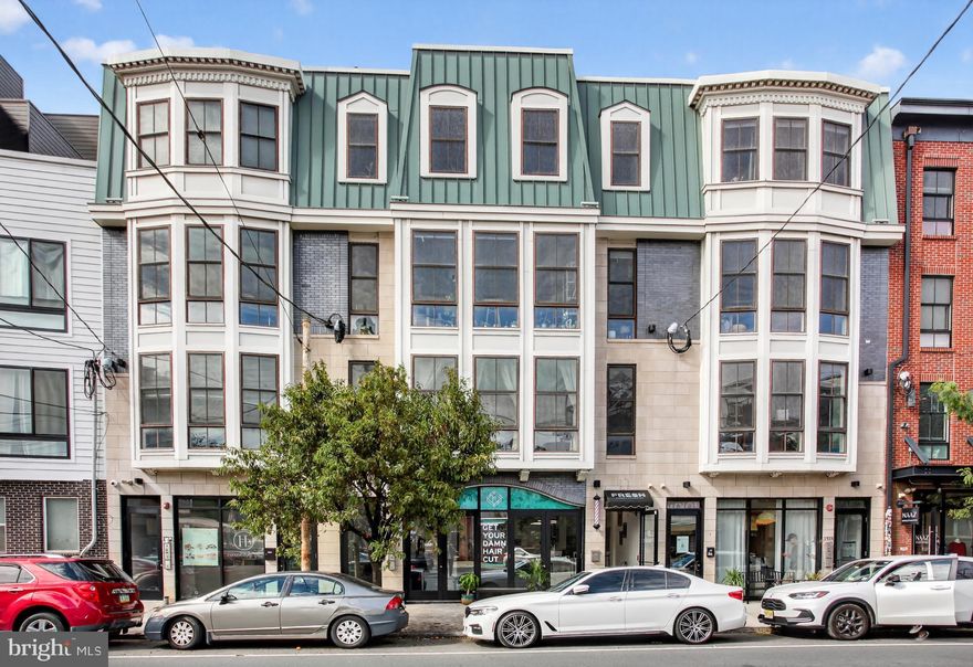 Discover an exquisite urban retreat nestled in the vibrant Fishtown neighborhood, where contemporary elegance meets modern convenience. This stunning 2-bedroom, 2.5-bathroom unit, built in 2016, offers an unparalleled lifestyle defined by sophistication and comfort. Step inside to find an open floor plan that seamlessly integrates living, dining, and kitchen spaces, perfect for both entertaining and everyday living. The gourmet kitchen is a chef's dream, featuring upgraded quartz countertops, a built-in range, and a spacious island that invites culinary creativity. The sleek design is complemented by high-end appliances, including a dishwasher, refrigerator, trash compactor, and in-unit washer and dryer, ensuring that every convenience is at your fingertips. Rich wood floors, recessed lighting and floor to ceiling windows enhance the ambiance, creating a warm and inviting atmosphere throughout the home. Thoughtfully designed window treatments provide both privacy and natural light, while the dedicated dining area sets the stage for memorable gatherings. The two well-appointed bedrooms offer a serene escape, each with easy access to beautifully designed bathrooms, ensuring comfort and luxury at every turn. Safety and security are paramount, with features such as carbon monoxide detectors, smoke detectors, and a main entrance lock, providing peace of mind in your urban sanctuary. Located in the heart of Fishtown, this property is perfectly positioned for those who appreciate a dynamic lifestyle. With convenient access to public transportation, including a bus stop less than a mile away and an airport within 10 miles, commuting is a breeze. Explore the eclectic mix of local shops, trendy restaurants, and vibrant nightlife that Fishtown is renowned for, all just moments from your doorstep. This unit is not just a home; it's a lifestyle choice that embodies luxury, convenience, and community. Experience the best of urban living in a space that reflects your discerning taste and desire for quality. Don't miss the opportunity to make this exceptional property your own-where every detail has been meticulously crafted for an elevated living experience.