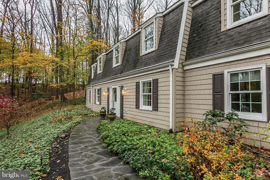 Shade gardeners paradise! Stunning gourmet kitchen with built in bookcases with access to outside. Large open living room with lots of windows and room for entertaining.  Beautiful hardwood floors on upper floor with Master BR/BA, an extra BR/BA and 3 BRS and family room on main level. Very lush gardens w/ Gazebo. 3 car garage. Large laundry room w/ shelving. All 5 bedrooms are generous in size.