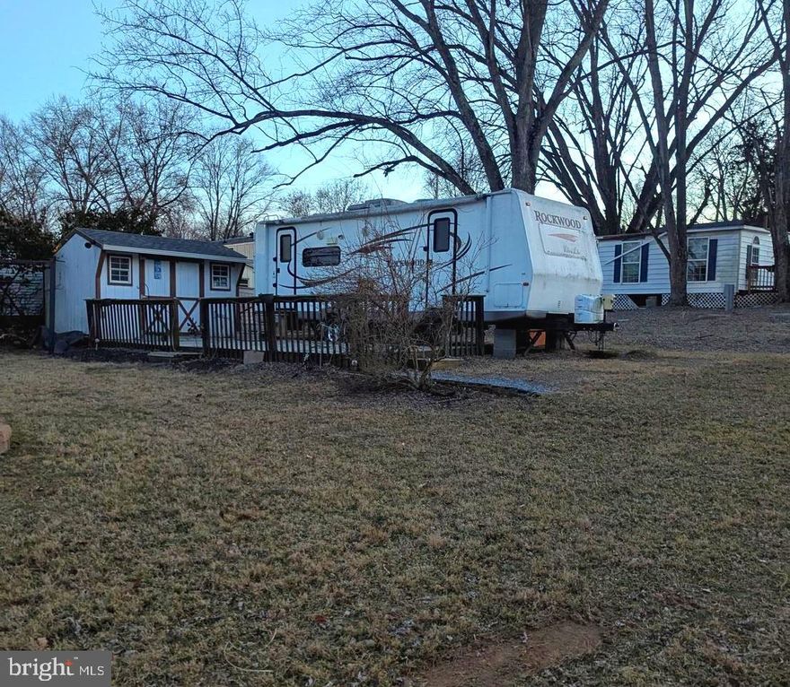 ***Property Details ***  Great Level lot with views of the river
Great level lot, has some partial river views.  This lot comes with a deck, shed, and 2010 Rockwell Camper. Seller also has Block 87 Lot 3 next to this lot for sale as well.  Bring the family and live the river life.  Come and check out this amazing lot **** Lets bring an offer to to table! ***BRING YOUR BEST OFFER*** YOU WON'T WANT TO MISS THIS ONE. 

This is a gated community so you need to enter at the guard shack. Entry is not permitted without ID per the office rules. Bring ID's to the office or guard shack for visitor pass. THIS IS A SEASONAL CAMPGROUND! OPEN FROM APRIL 1 TO NOVEMBER 1. ** WELCOME TO RIVER BEND/SEASONAL LOT AVAILABLE TURN KEY** River Bend is a privately owned 400 acre recreational- vehicle camp resort with seasonal activities for members, families and guests. This great RV park is tucked away on the Upper Potomac River of West Virginia, River Bend is one of West Virginia's most popular family seasonal destinations. . Just a short drive from the Washington and Baltimore metro area. Open with utilities from April 1 to November 1. Lot owners have access to their property the entire year. *** Members Enjoy *** * Amazing views and wildlife, Potomac River access, Trails, Swimming pools, Mini-Golf, Youth center, Tennis and basketball courts, laundry facilities, convenience store, deli and lounge. *Bath houses through out the park, boat ramp, bar and grill and even a church located on the grounds. River Bend also hosts numerous activities such as 4th of July fire works, small carnival, bonfires, poker runs, horse shoe tournaments, car show, Halloween Trick or Treat and so much more.