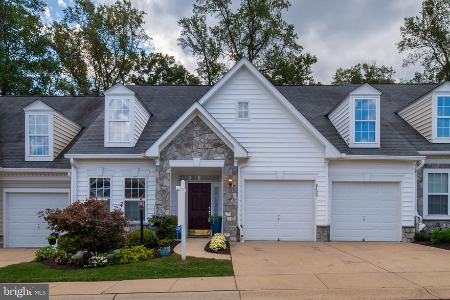 Ever popular Snowden Overlook, your 55+ lifestyle awaits - this 2 car garage villa is the perfect size & is situated on a private lot backing to trees! The main level of this classy, easy living residence has an open, flowing floor plan including living & dining rooms with soaring ceilings; a cozy sunroom with 2 sided gas fireplace & surround sound; an eat in kitchen with generous counter & cabinets space + upgraded appliances & backsplash; convenient laundry + 2 bedrooms & 2 baths (primary suite includes a walk in closet & private bath). The entire main level has hardwood or ceramic tile flooring. The upper level has a versatile loft, 2 storage closets, & a full bath. The expansive lower level provides ample storage area, a large recreation room, a separate den, another full bath, & areaway exit to the rear yard. Enjoy relaxing on the deck situated just off of the kitchen or stroll down to the fantastic community clubhouse (that includes a pool, large covered terrace, game room, library & gym) to socialize with your neighbors. In addition to the amazing community amenities, fees cover Homeowners Insurance,  lawn service - mowing, fertilizer & mulching, snow removal, roof repairs & replacement + main entrance gate (open 5am - 8pm).