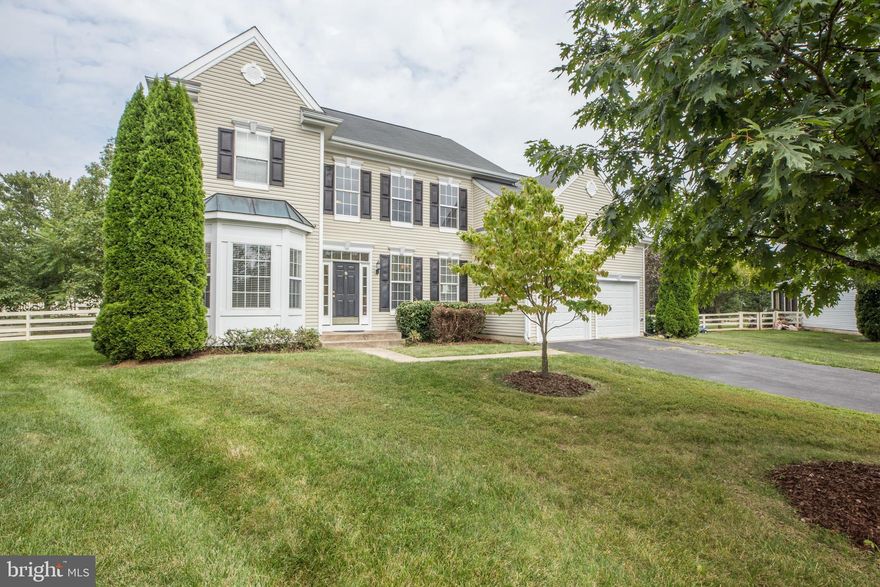 Stunning, spacious home on beautiful cul de sac! Features 2-story foyer w/ hardwood floors, expansive windows, bright & open layout, updated kitchen w/ cherry cabinets, new granite counters, flooring and newer appliances (2018), lovely living room w/ fireplace, GRAND master suite w/ vaulted ceilings, custom lighting, new carpet, full basement, attached 2-car garage, fenced yard & more!  Great location - easy access to Rte 7, near park, school, aquatic center (low fee), playgrounds, etc!