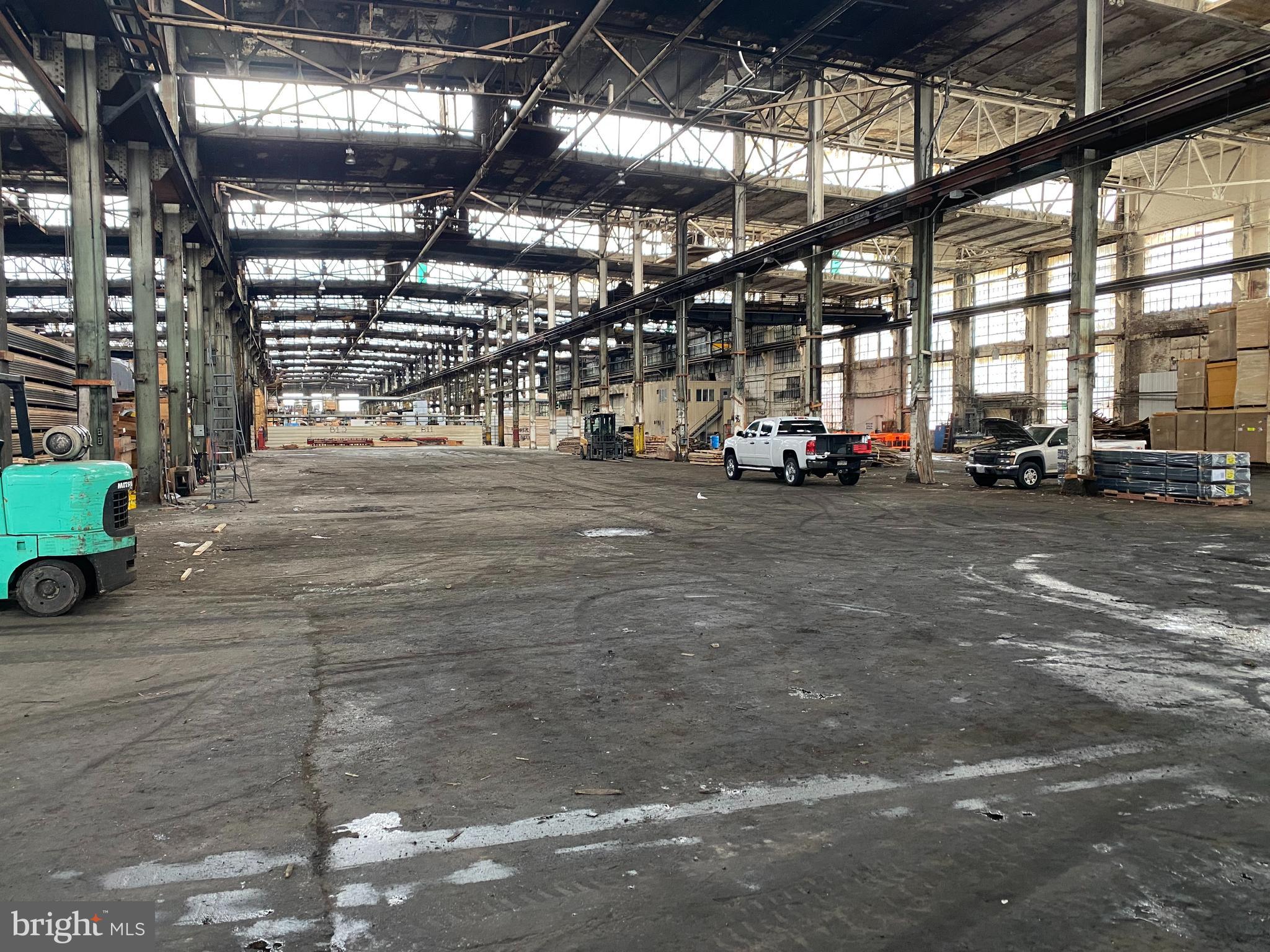 10,000 sf of warehouse space. Currently used for dry storage, and could be repurposed for manufacturing with 480Amp electric available. The clear height is 25 ft. with the roof being 37 ft. high. The space is accessed via a 14'x14' overhead door. A common aisle offers space for pulling in trucks for loading & unloading. Adjacent office space is available at an additional rate.