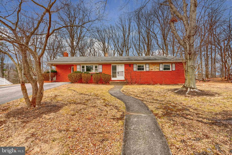 4 BR, 3BA brick ranch located at the end of a quiet cul-de-sac. The primary suite includes a spacious Bathroom with a soaking tub, a separate shower, and a large 2-sink vanity. The primary bedroom has 2 walk-in closets.  The bright living room/dining room with vaulted ceiling leads to a large 23' x 15' deck overlooking the tree-lined backyard. Cozy family room with a fireplace. The finished basement includes a full bathroom, a bedroom, and a Large finished Rec Room. There is a walkout to a screened patio from the basement. Carport has an EV charger. 2 Separate Furnace/AC systems. Sold As-Is.