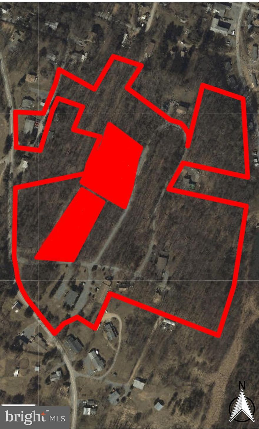 Incredible investment opportunity for a savvy and capable investor! 23 units across 6 buildings on +/-20 acres in picturesque Berkeley Springs. 156 Tower Circle is 4 units consisting of 2 bedrooms and 1 bath.
50 Briarwood Circle is 6 units consisting of 2 bedrooms and 1 bath. 132 Briarwood Circle is 4 units - 3 units have 3 bedrooms and 2 baths with a 1 car garage. 1 unit is 2 bedrooms with 1 bath with no garage. These units have central HVAC.  120 Tower Circle is a detached single family home.  70 Briarwood Circle is 4 units consisting of 1 bedroom and 1 bath.  277 Briarwood Circle is 4 units consisting of 2 bedrooms and 2 baths. The spacious lower level was previously occupied by the owner.  All utilities separately metered with public water & sewer.  All units are currently vacant and need varying amounts of work ranging from moderate to full rehab. Consult with the county on the possibility of building additional units or subdividing lots on the remaining acreage to increase your return on investment.  Strong tenant demand.