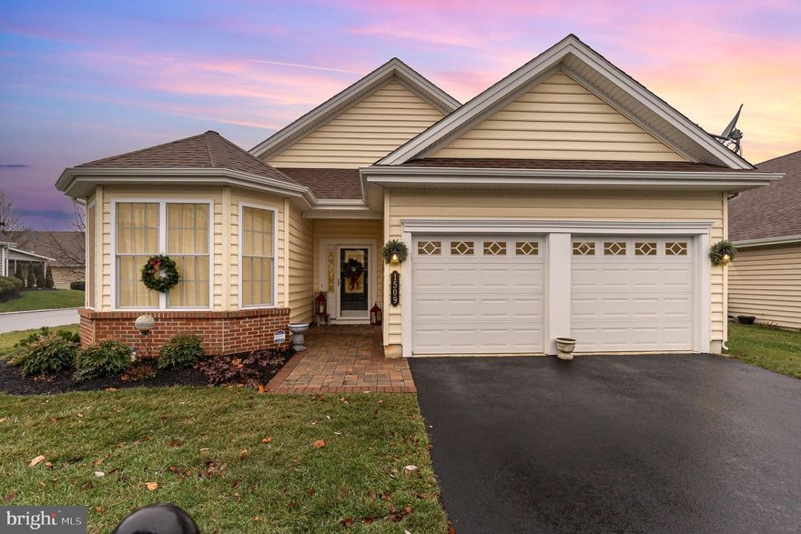 An absolute stand out home in the the prestigious Four Seasons at Elm Tree Community. Enjoy all the amenities this 55 plus community offers complete with comfort, convenience, a relaxed lifestyle and the enjoyment of the activities provided which include the Clubhouse, heated pool/spa, social gatherings and numerous events waiting for you. This home boasts of over 2400 square feet with tons of upgrades, making it perfect for the entertainer. The spacious floor plan, plus all the natural light, create an inviting atmosphere whether just taking a minute to chill or talking with friends and family. You'll appreciate the hardwood flooring and crown molding through out, tray ceiling in the foyer, huge kitchen island, lots of functioning countertop space, all the appliances, warm family room with gas fireplace, and a formal dining room and living room. The primary bedroom provides ample space adjoining the bath with an incredible walk in shower with all the gadgets. Enjoy some fun time on the screened in patio with a cathedral ceiling and ceiling fan. From the two car garage are walk up stairs accessing the to additional area where the furnace is located along with some possible storage. This meticulously maintained property is certainly one you want to set up a tour on, it is quite impressive!