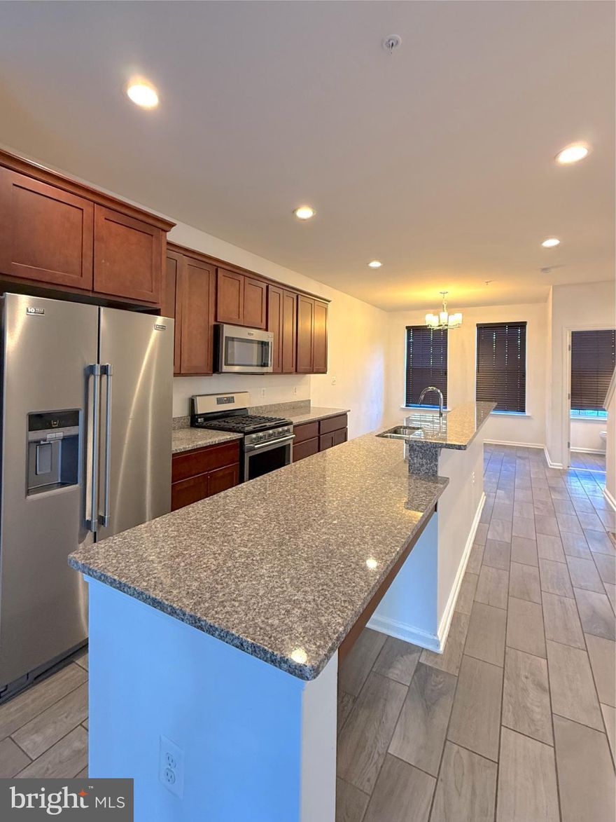 Spacious and beautifully appointed 3-bedroom, 2.5-bath townhome featuring a 2-car garage and a prime location just minutes from major commuter route I-495 and shopping at Ritchie Station Marketplace. The main level showcases elegant hardwood flooring and a gourmet kitchen complete with stunning granite countertops, a gas cooktop, and a double wall oven—perfect for everyday living and entertaining.

Step outside to enjoy low-maintenance outdoor living on the composite deck. The owner’s suite provides a relaxing retreat with a garden-style soaking tub. Residents also enjoy access to a community clubhouse with a fully equipped gym for added convenience.

Style, comfort, and convenience come together in this exceptional home — don’t miss your opportunity to make it yours!