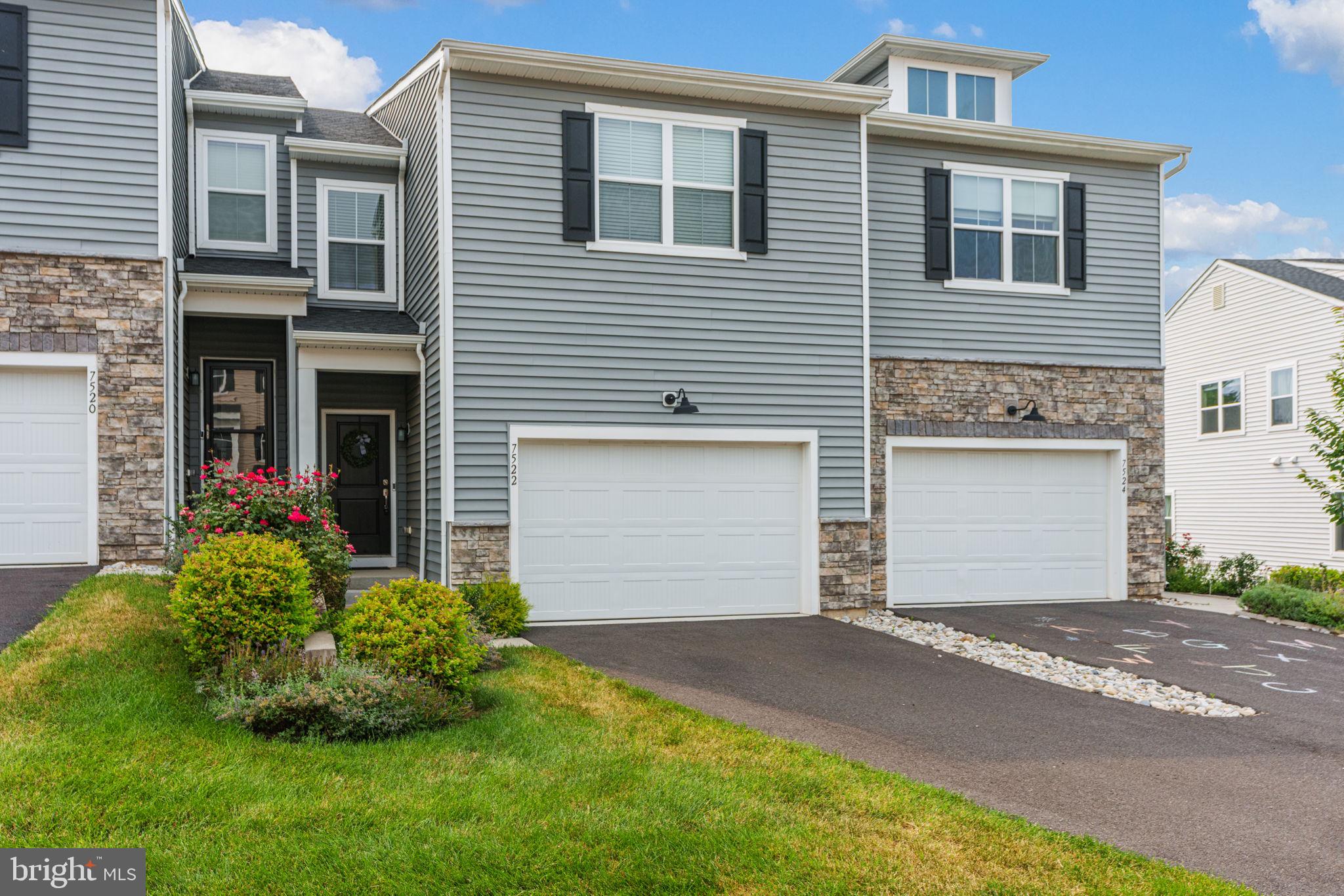 Stylish nearly New Townhome in Southern Lehigh School District. Welcome to 7522 Clayton Avenue—where comfort, convenience, and community come together in one stylish townhome. Located in the desirable Brookside Court neighborhood of Upper Saucon Township, this 3-bedroom, 3.5-bath home offers a spacious open floor plan, modern finishes, and room to grow. The main level features resilient flooring, a bright living room, and a sleek kitchen with center island, gas range, and built-in microwave—perfect for everything from quick breakfasts to weekend entertaining. A convenient powder room and access to the rear deck round out this level. Upstairs, you'll find a versatile sitting area, three bedrooms including a spacious master suite with private bath and walk-in closet, plus an additional full bath. But wait—there’s more! The finished, walk-out lower level adds approximately 500 square feet of flexible living space, complete with a full bath—ideal for a family room, rec space, home gym, or guest suite. All this in the highly regarded Southern Lehigh School District, within walking distance to charming downtown Coopersburg shops, cafés, and restaurants.