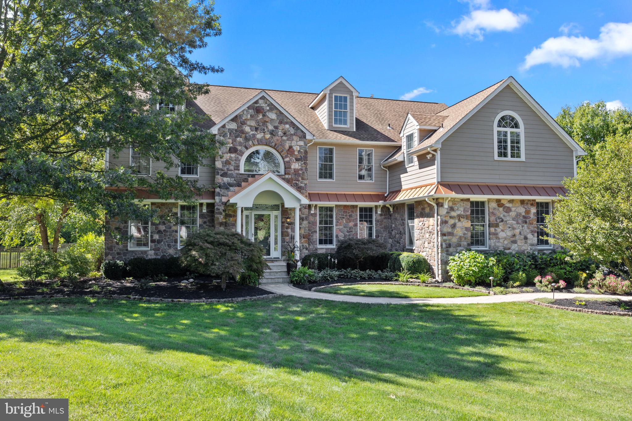 Looking for your Dream Home? Welcome to 3340 Kevin Lane, located on 2.27 scenic acres in desirable Buckingham Township. As you drive up long driveway to this beautiful estate home located on a small cul-de-sac, you will fall in love with the exquisitely appointed exterior of Hardy plank, stone and copper roof accents surrounded by mature professional landscaping. Under the home’s portico, enter into this meticulously well-kept and tasteful home where you are greeted by a grand two-story Foyer and Staircase. Brazilian cherry wood floors lead you to the Front Room, perfect for a quiet Sitting room or a Playroom. Host your holiday meals in the updated Dining Room with a tray ceiling, board and batten wall trim, and gorgeous chandelier. The Gourmet Chef’s Kitchen is sublime with its plentiful Cabinetry, Granite counters, recently updated tiled Backsplash, new Lighting Fixtures, renovated walk-in Pantry and high-end Stainless appliances including Built-in Refrigerator, Gas range Stove top with Hood, Wall Oven, Built-in Microwave, and Dishwasher. Enjoy your morning coffee in the Breakfast Nook and take in the beautiful view of the sprawling, secluded backyard. The two-story Living Room is the perfect place to relax featuring Brand-new Carpeting, a stunning floor to ceiling Stone Gas Fireplace, access to the Back Staircase, and French doors leading to the Back Deck. The Newly Renovated Laundry/Mudroom has floor to ceiling Cabinetry, Laundry prep area, Custom Bench and Coat hooks, a convenient Laundry shoot from the second floor, and connects to the home’s spacious 3-car Garage with lots of overhead and built-in storage. Tucked away on the other side of the first floor and next to the Powder Room is the Office/Study with Brand-new Carpeting, fresh Paint, new Ceiling fan and additional set of French doors leading out to the covered Deck. Upstairs, unwind in the expansive Owner’s Suite with Recessed lighting, beautiful Ceiling fan, a Gas Fireplace, double Walk-in Closets and a luxurious Ensuite Bath complete with Double sinks with Granite countertops, plentiful Cabinetry, Soaking tub, double-headed Glass shower, Heated Floors, and private Water Closet. Four spacious Bedrooms with ample Closet space, two Recently Renovated Hall Baths, and a generous Linen Closet finish out the second floor. Venture down to the Finished Basement where additional living/entertaining space awaits you including a Full Bathroom, Pool table, Kitchenette with sink, and a large Bonus Room perfect for a movie or game night. There are two unfinished side rooms ideal for storage and a glass sliding door for easy access to the Backyard. The true beauty of this home is in its Backyard surrounded by extensive and gorgeous hardscaping and landscaping. You can take in the peaceful view of the property on the sprawling and newly stained Ipe wood Back Deck, eat al fresco or watch a movie under the custom covered Deck area, sunbath on the expansive Pool deck, or take a dip in the heated In-ground Pool and Spa with new pool heater. A sizable portion of the backyard has been fenced in, perfect for letting the dog or little ones play outside safely. Outdoor storage is not a problem in this home with not only a Pool Shed for all your equipment but an additional Large Shed for all your lawn care needs. With a Whole House Generator, two Outdoor Propane Hook-ups for grills, Water Purifier and Softener systems, New Sump Pump, three Zones for Heating/Cooling and two Hot Water Heaters, this home is fully cared for and ready for its next owner. Assigned to the award-winning Central Bucks School District and located close to Peddler's Village, historic New Hope, downtown Doylestown and the Delaware River, this house is a must see. Additionally, with access to major highways and turnpikes, this home is commutable to New Jersey, New York, and the adjacent Montgomery, Lehigh and Chester Counties. Schedule your showing today!