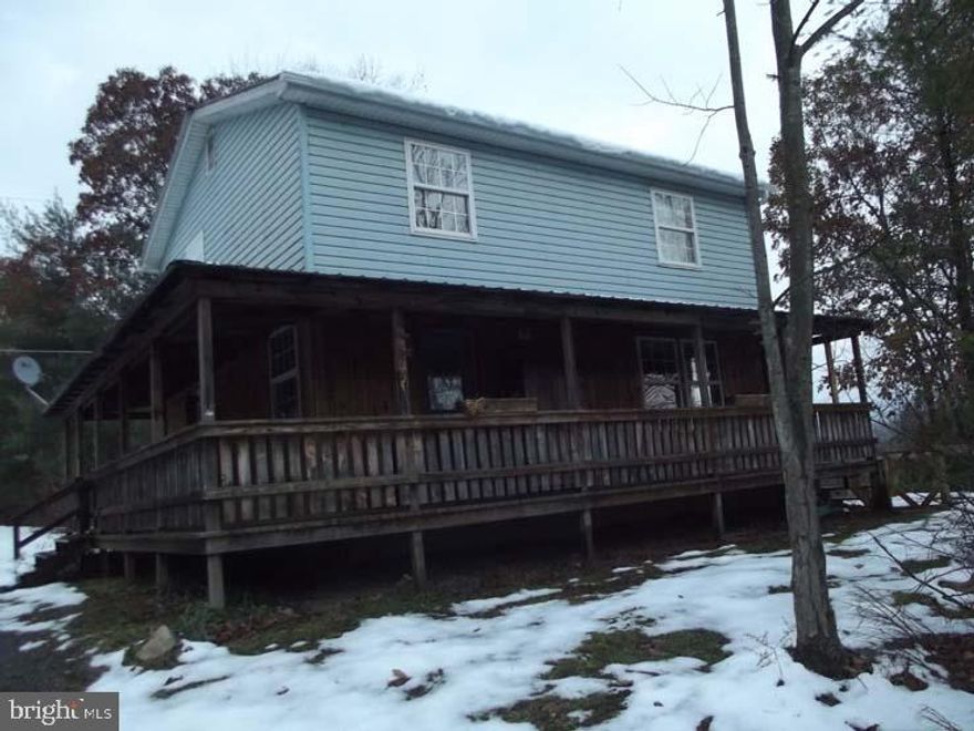 Oversized 2 car garage. Wrap around covered porch. Fenced dog area. Close to hunting. Would make a nice camp. Walls are knotty pine.