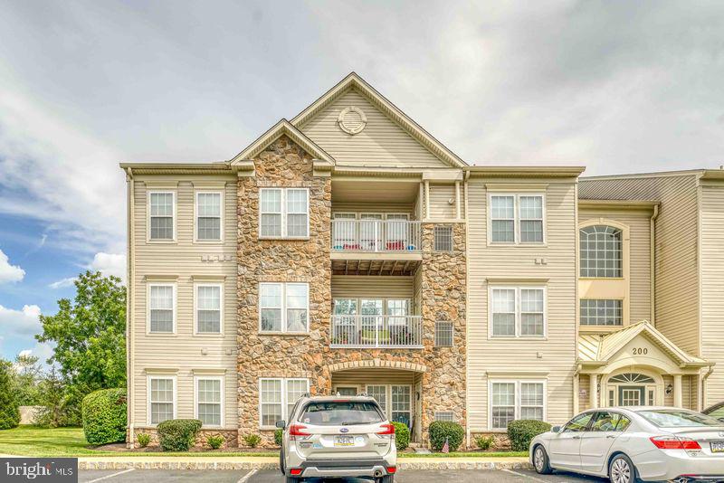 This beautiful Forest Ridge 55+ senior community 3rd floor penthouse condo where the living is easy may be the one you have been waiting for. This unit, a former sample for the builder, has been meticulously maintained, upgraded and tastefully decorated offering 1,800 square feet of living area inclusive of a second story loft which is just one of the items of distinction in this home.
This 2 bedroom, 2 bathroom home is accessed through a 1st floor secured entry door and a brief elevator ride to the penthouse. Upon arrival you will be met by a 24'x24' voluminous living room with vaulted ceiling and a wall of windows that captures the the natural lighting. This area yields perfectly to entertaining with great space for that oversize TV of your dreams, an existing gas fireplace, a bar height countertop with stools and convenient proximity to the formal dining room and private exterior balcony. The adjacent kitchen with 42" cabinets and lots of them complemented by upgraded granite counter tops with ceramic tile backsplash throughout. You will certainly appreciate the full size kitchen pantry, elegant stainless steel kitchen appliances and newer washer and dryer in the laundry closet.
Adjacent to the kitchen you will find the main bedroom with a generous 180 sq/ft, a full walk-in closet and a separate double wide closet with by-pass doors. The main bedroom bathroom provides a double vanity and sinks with lots of internal storage, a stall shower and a full size linen closet.
Across the living room on the home's opposite side is a second bedroom with a full size vanity, combination tub/shower and linen storage closet.
The only remaining piece of this top-shelf property is the second floor loft which is best appreciated in the pictures here!