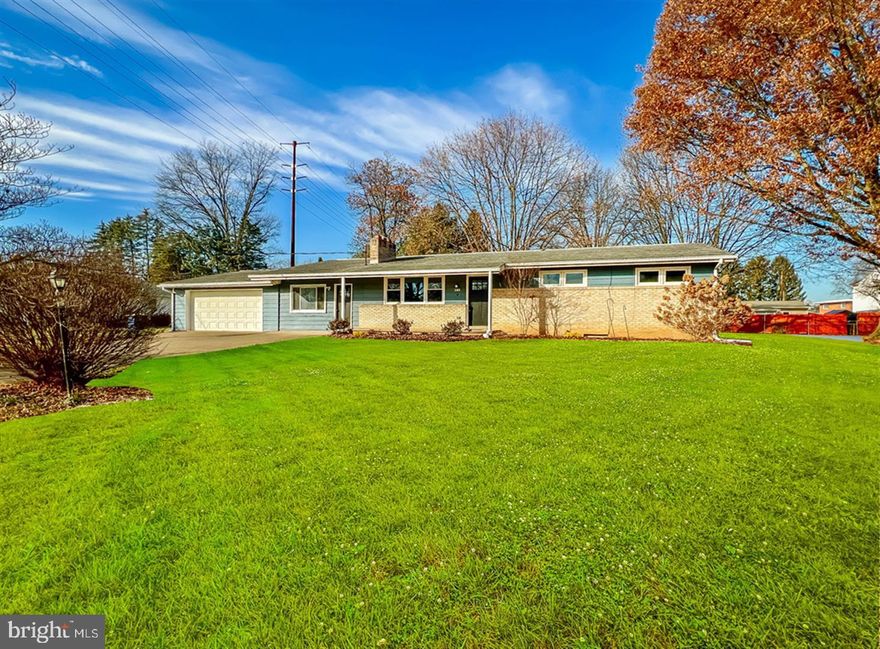 This newly renovated 3-bedroom, 1.5-bath ranch-style home with 2-car garage sits on over half an acre in a mature, residential neighborhood just minutes from Downtown Mechanicsburg.  This home features beautifully refinished hardwood floors throughout the main living space and bedrooms as well as lovely luxury vinyl tile in the kitchen and bathrooms.  The kitchen has been completely re-done and includes all new Shaker-style cabinets, quartz countertops, and stainless-steel appliances.  Separate dining space connects the kitchen to the bright living room with feature fireplace.  In addition to the full bathroom, the primary bedroom, also, enjoys its own en-suite powder room.  Plenty of storage space in the full basement with washer/dryer hook-up.  The finished breezeway room provides access to the garage and to the large backyard and covered patio.  New hot water heater.  Great location with easy commutes to I-76 and Carlisle.  Please, note, this house has multiple heating systems: a newer electric (forced air) system (located in attic), electric baseboard heating, and vestibule heating.