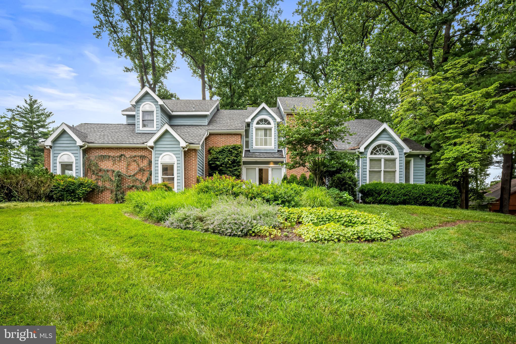 Tucked away on a quiet, serene court, this thoughtfully designed home blends indoor comfort with outdoor charm. A beautifully remodeled eat-in kitchen is the heart of the home, featuring an expansive island, walk-in pantry, and abundant storage—ideal for everyday living and entertaining. The sunken family room with a gas fireplace flows effortlessly into a screened-in porch, perfect for relaxing or dining al fresco. An elegant living room and spacious dining room make hosting holidays a joy, while a main-level powder room and mudroom add convenience. Upstairs, the large primary suite impresses with cathedral ceilings, walk-in closet, custom built-ins, and a freshly tiled walk-in shower. A second bedroom includes built-in office space, offering function and flexibility. The fully finished lower level adds even more versatility, with two additional bedrooms, a full bath, and areas for work, play, or exercise. With a oversized one-car attached garage, extra storage shed, underground sprinkler system, two-zone A/C, and a whole house fan, this home truly checks all the boxes. Enjoy the peaceful nature from your oversize deck.
