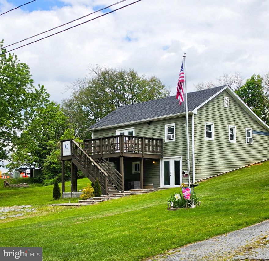 Welcome to this cute and charming two-story home nestled in a peaceful setting with access to the beautiful Conococheague Creek, offering relaxing water views and the perfect blend of comfort and recreation.

This inviting property features 2 bedrooms, a comfortable living room, and a functional kitchen, making it ideal as a full-time residence, weekend getaway, or Airbnb investment opportunity. The primary bedroom suite opens to a large private deck, perfect for unwinding while taking in the serene surroundings.

The fully finished lower level expands your living space and is ideal for entertaining, complete with a game table setup and walkout access to a patio, creating a seamless indoor-outdoor experience. With approximately 2,112 total square feet across both levels, there’s plenty of room to enjoy.

This is a two-parcel property with separate tax IDs, offering added flexibility and value. The home itself sits on 0.61 acres across the street, while the additional 2.35-acre parcel fronts the Conococheague Creek, providing a scenic, private setting perfect for recreation, outdoor enjoyment, and enhancing the overall experience of the property. While the creek-front lot is not buildable, it offers incredible space for relaxing, exploring, and enjoying nature.

Additional highlights include laundry on the lower level and plenty of outdoor space for gatherings or future enhancements.

Whether you're looking for a personal retreat or a property with strong short-term rental potential, this unique offering checks all the boxes.