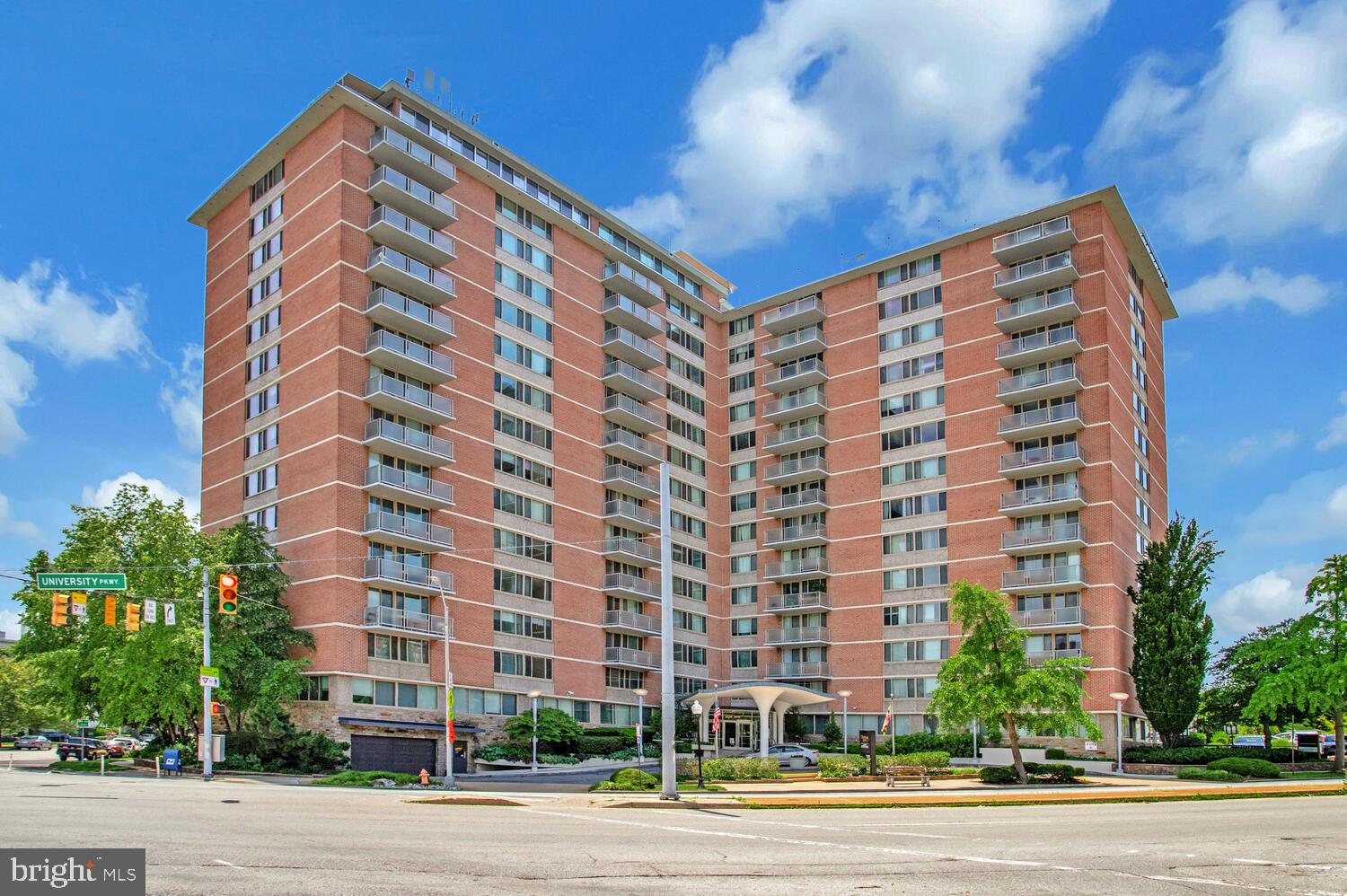 Bright and inviting, this 4th floor condo at 1 E University Pkwy #410 offers an unbeatable location just one block from Johns Hopkins University, with convenient shuttle access to the Medical School. Inside, you'll find wood floors throughout and a spacious layout that includes a private balcony—perfect for enjoying city views. Residents have access to a rooftop pool with panoramic skyline vistas, a well-equipped fitness room, and a laundry room located right in the building. Whether you're looking for a smart investment or a personal retreat near campus, this condo offers a unique combination of comfort, convenience, and amenities—all in the heart of Charles Village. Enjoy included utilities in the condo fee, which will be reduced to $941/month in December 2025. This listing has been virtually staged.