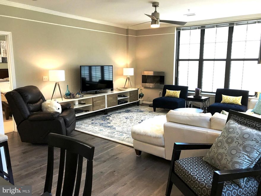 Rarely available 1284 sq ft 2BR/2BA large corner unit in desirable Spectrum building. 2 garage space plus free public garage parking for visitors. Gas, water, basic cable/internet, and great amenities included in rent! Light-filled, spacious open floor plan with balcony facing quiet grass courtyard. Gorgeous wood flooring, central kitchen w/granite, big island/breakfast bar, stainless steel appliances, and gas cooking. Super fun, excellent location with W & OD Trail, parks, restaurants, shopping, and pubs nearby. Easy 1.5-mile walk to East Falls Church and West Falls Church metro stations although the bus goes right past the front and the BikeShare’s on the corner. Amenities include a 3rd-floor Lounge, 4th-floor Fitness Center, Rooftop Terrace, Courtyard/patio area off of the Party Room (with Billiard table!), Theatre Room, Conference & Tech Room, huge lobby with daily staffed Concierge Desk, and M-F on-site Management. Conveniently located inside the beltway, Heart of Falls Church, walk to shops & restaurants, easy access to Tyson's Corner & major routes. Sorry, no pets. Building move in and move out fee $350/each, elevator refundable deposit $500. Available 9/7, Welcome Home!