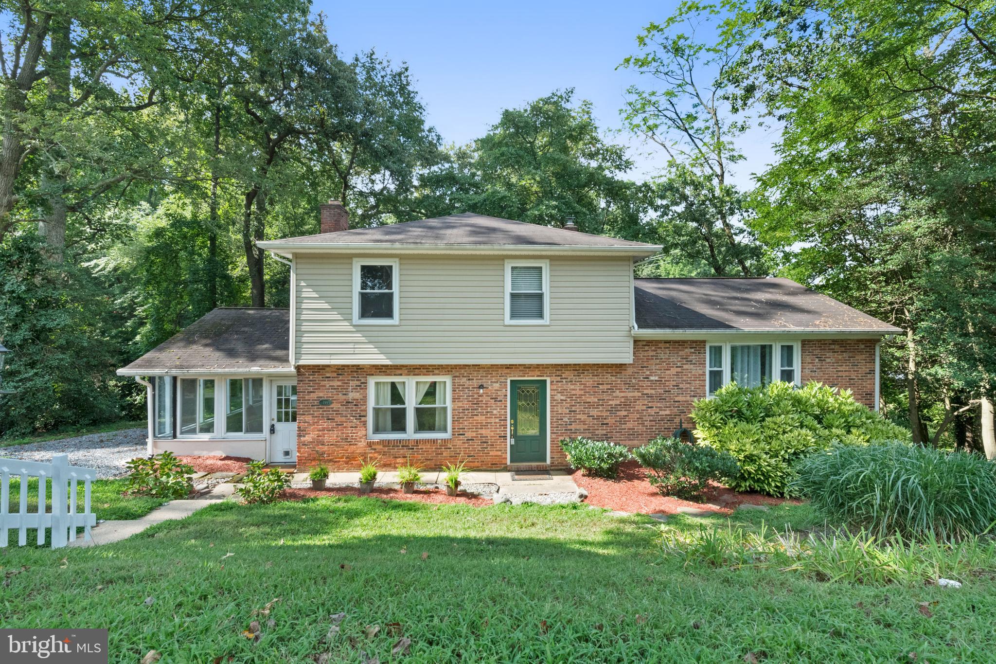 WONDERFUL WATER VIEWS of Beards Creek! Located in the quaint neighborhood of Southdown Shores, this home boasts hardwood floors, large eat in kitchen, spacious family room with brick fireplace, master bedroom with ensuite bath, sunroom, and fresh paint. Plenty of cabinets and countertop space in kitchen. Ample storage space for your bikes and water toys in the unfinished basement. Walk out from the basement to the backyard patio to the waterfront. Enjoy coffee with views or set up your fire pit for cooler nights. Fenced in back yard. The community pool - just down the street! You are just steps to the community pier so bring your kayaks, canoes and boat! Hidden gem right in the heart of Edgewater! Make this your next home!