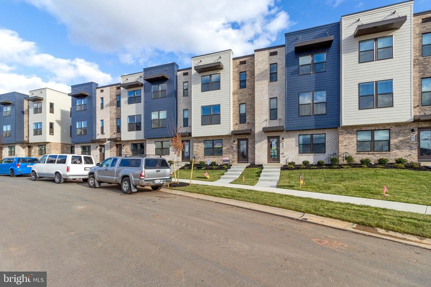 Brand new townhome featuring a spacious owner’s suite serving as a serene oasis, an expansive walk-in closet, three extra bedrooms, three full baths, and a convenient half bath, this residence caters to all your needs. Situated within walking or biking distance of Historic Frederick, Renn Quarter promises a wealth of exclusive amenities. Expect swimming pools, a clubhouse, parks, vast open spaces, picnic pavilions, soccer fields, dog parks, playgrounds, restaurants, shops, a bustling farmers market, and much more, making this community a sought-after destination.
Not only is it a short stroll to the pool and clubhouse, but it's also conveniently close to the river-walk and shopping areas. Frederick's residents relish the city's rich history, pedestrian-friendly streets, charming boutique shops, numerous breweries, restaurants, bars, and an array of attractions. Additionally, it's renowned as one of the most dog-friendly cities in the United States. This townhome in the historic district offers everything you desire, combining modernity with the charm of a new construction. The Norris townhome stands out among others with its ultra-urban streetscape, an open-concept layout adorned with stylish finishes, and an overall allure that captivates.