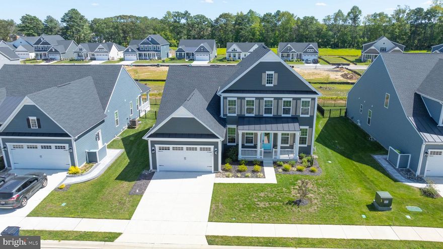 Discover your dream home at 27075 Fieldfare Road, where this brand new home meets thoughtful design in Lewes, Delaware. This never-lived-in residence offers five bedrooms and four bathrooms, perfect for seeking both space and comfort. The main level features an open concept floor plan that seamlessly connects daily living areas. The gourmet kitchen showcases quartz countertops and stainless steel appliances, creating an ideal space for cooking and entertaining. Custom installed  Levolor blinds add privacy while maintaining natural light throughout the home. A first-floor bedroom provides convenient single-level living, while the drop zone off the garage keeps everyday items organized. Multiple storage rooms ensure clutter-free living, and the finished basement expands your living space significantly. The lower level includes a recreation room, full bathroom, and additional bedroom, and rough-in for a wet bar and all accessible through its own outside entrance or inside the home. Step outside to enjoy the covered rear porch, perfect for morning coffee or evening relaxation. The automatic lawn irrigation system maintains the grounds effortlessly, while lawn care services are included for your convenience. Community amenities feature a pool, 2 pickleball courts and clubhouse for recreation and social gatherings. Location advantages include close proximity to Delaware's beautiful beaches, making weekend getaways conveniently accessible. The location is ideal with easy in and out to shopping, entertainment and dining without getting on main highway. Cape Henlopen State Park offers outdoor recreation, while nearby Rehoboth Beach provides dining, shopping, and entertainment options. The Tanger Outlets at Surfside offer convenient shopping, and medical facilities like Beebe Medical Center ensure healthcare needs are easily met. This move-in ready home combines modern construction with practical amenities. The basement's versatility offers options for a home office, guest suite, or entertainment area. Storage solutions throughout the home accommodate everything from seasonal items to daily necessities. The open floor plan maximizes space while maintaining defined areas for different activities. Quality finishes and attention to detail reflect the care taken in this home's construction. The screened porch extends living space outdoors, protected from insects while enjoying fresh air and natural surroundings. Community pool access provides recreation without maintenance responsibilities, while the clubhouse offers space for gatherings and events. The location balances peaceful residential living with convenient access to coastal attractions, shopping, dining, and essential services.  This exceptional property represents an opportunity to own a quality-built home in a desirable Delaware location, combining modern amenities with the charm of coastal living. This home comes with a 1 Year Home Warranty and comes with the builders 10Yr. structural warranty that transfers to new owner.