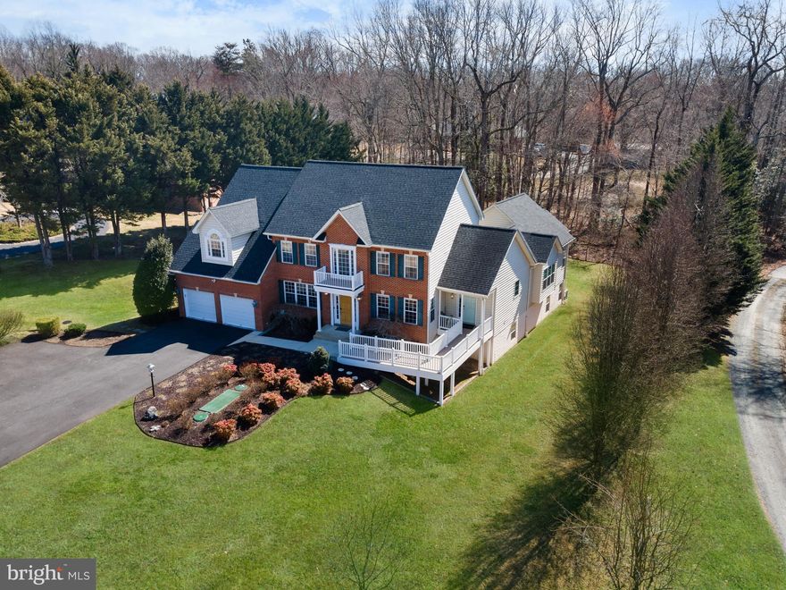 Welcome to your dream home nestled in Northern Calvert. This impressive 7-bedroom, 4.5-bathroom residence offers the perfect blend of elegance, comfort, and style perfect for multi-generational living.   As you step through the front door, you're greeted by a sophisticated atmosphere graced with a beautiful stairway and an expansive two story foyer with natural wood flooring.  The natural wood flooring extends to the dining room off the kitchen and thru the formal living room.  Through the French Doors, is the welcoming family room featuring a cozy pellet stove—perfect for cozy winter nights. The  gourmet kitchen is a chef's delight, offering a large center island, step in pantry, and built in coffee station allowing abundant counter space for your culinary creations and entertaining. 
Unique to this home is a separate, fully-appointed apartment—perfect for extended family, guests, or an income producing rental...complete with its own full kitchen with solid maple cabinetry and soft close drawers, large full bath with laundry area, and separate entrance.  The attached apartment was build in 2015 and can be access from either the exterior ramp or thru an interior security door.  The finished basement, features additional living space, including a bedroom, full bath, kitchenette, and a walk-out adding versatility to accommodate all your family's needs.  There is even a large workshop and unfinished area with a second walkout.  This space is perfect for a theater room, home gym, or whatever your imagination can dream  up!
Outdoor enthusiasts will fall in love with the beautifully crafted gazebo perfect for sipping your morning coffee or an afternoon cocktail.  The large deck and  stone patio with built-in fireplace is perfect for hosting barbecues or enjoying a quiet evening under the stars.
The beauty has been meticulously maintained with a new roof in 2024,  a new BAT Septic System in 2015, new paved driveway in 2024, new hardwood flooring in 2021, and installation of an Aquasana  Rhino water filtration system.
Enjoy the convenience of Dunkirk  with an array of local restaurants, parks, shopping, and schools, ensuring a bustling community life while still offering a private retreat.
Schedule your private showing on your future home today! 🏡✨
#DunkirkLuxuryLiving #MarylandRealEstate #DreamHome #HomeSweetHome #FamilyHome