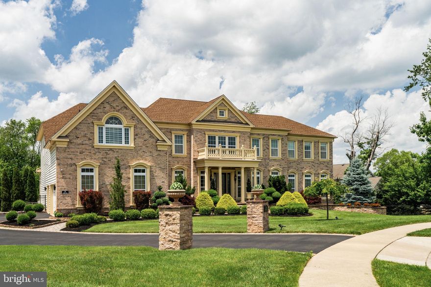 Welcome to 26 Oxford Drive—undoubtedly one of the most distinguished residences within The Reserve at Northampton. Perfectly sited at the end of a premium cul-de-sac on a lush, professionally landscaped one-acre lot, this exceptional Henley Versailles model offers more than 7,300 square feet of refined living space and every amenity for an unparalleled lifestyle. A grand two-story foyer, crowned by a dramatic double staircase and intricate trim work, sets the stage for the home’s impressive scale and attention to detail. Hand-scraped hardwood floors flow seamlessly throughout, highlighting the level of craftsmanship found in every room. Designed for both comfort and entertaining, the expansive living spaces include a formal living room, an airy conservatory, and an inviting great room with custom window treatments. The true gourmet kitchen is a chef’s dream, appointed with top-tier Jenn-air, Wolf & Sub-Zero appliances, elegant finishes, generous sized center-island and beautiful stone countertops. Adjacent to the kitchen lays the breakfast area, just beyond, 8’ Pella sliding doors lead to the backyard oasis, complete with a retractable awning—perfect for summer gatherings. Each of the five bedrooms is a private suite with a sitting area and a luxurious en-suite bath, offering the utmost in comfort and privacy for family and guests. The expanded kids’ bedroom features custom built-ins, The primary bedroom suite features a sitting area and a magnificent primary bath. Don't miss a hidden door leading to a bespoke walk-in closet fitted with custom cabinetry and shelving. The fully finished lower level, with over 2,400 square feet, is a destination in itself. Enjoy a walk-in wine vault, a state-of-the-art fitness room, a spa retreat with custom sauna, and a dedicated media/theater lounge for movie nights. The game room and sound system provide endless entertainment, while the stunning bar area is equipped with a microwave oven, Sub-Zero freezer and beverage cooler, and a dishwasher—making it perfect for hosting and celebrations. Step outside to discover your own private resort. The saltwater heated pool, cabana, and fully equipped outdoor kitchen are surrounded by extensive landscaping, creating the ideal setting for relaxation and unforgettable gatherings. Additional highlights include heated floors, a whole-home water softener and filtration system, a Generac standby generator, multiple HVAC zones, and an oversized garage with custom built-ins for maximum organization. Located just minutes from the best of Bucks County, including the shops and restaurants of Newtown and New Hope, 26 Oxford Drive represents a rare opportunity to own an extraordinary home in one of Northampton Township’s most coveted communities. Don’t miss your chance to experience this truly remarkable residence—schedule your private tour today.