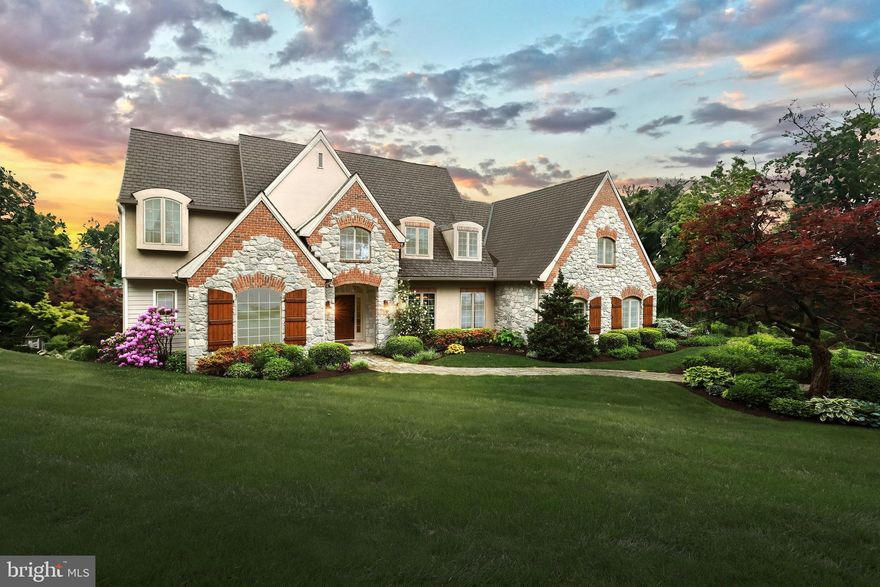 Nestled on a sprawling 5.13-acre parcel of lush woodland, 327 Imperial Dr welcomes you with the charm of a French Country estate and the tranquility of a private retreat. Outdoor enthusiasts will revel in the property's thoughtful design, featuring a west facing patio with unparalleled views of York County's picturesque sunsets, flourishing perennial gardens that enchant from early spring to late fall, and a serene backyard pond complete with a cascading waterfall and a two-tiered patio that seamlessly blends into the natural landscape.
This meticulously crafted residence combines elegance with functionality, boasting 6 bedrooms and 5.5 bathrooms, four of which are ensuite. With three cathedrals ceilings, one vaulted and windows galore, the home is flooded with natural light and offers breathtaking views at every turn. The home features hardwood flooring on the first and second stories, a three-car garage, a Sonos S1 sound system, an alarm system, a three-zone geothermal HVAC and so much more!
Guests arriving through the grand foyer are greeted by a soaring two-story entryway with an oak staircase adorned with wrought iron spindles. To the left, a sophisticated study awaits, featuring French doors, a vaulted ceiling, and custom cherry cabinetry with a floor-to-ceiling Palladian window overlooking the front garden. To the right, an inviting dining room beckons with its pillared entrance, arched doorways, and ample space to accommodate large gatherings. The living room is equally impressive with a vaulted ceiling, Rococo/Baroque style plaster mantle/fireplace (gas), custom built-in cabinetry and a bank of windows overlooking the pond/waterfall.
The heart of the home lies in the well-appointed kitchen, complete with granite countertops and top-of-the-line appliances including a Subzero refrigerator, GE Profile double ovens, and a Thermador gas cooktop. A breakfast nook nestled within the turret offers panoramic views of the backyard oasis, while a nearby Wine Pantry with cooler adds convenience to entertaining. The kitchen seamlessly flows into the cathedral-ceilinged family room, which features a wood-burning fireplace framed by natural stone and a wall of windows overlooking the patio, the stream, and a view of the lush valley below the house.
Upstairs, the luxurious primary suite awaits, boasting a cathedral ceiling, gas fireplace with a marble surround, Juliet balcony, and spa-like ensuite bathroom with a tiled shower, whirlpool bath, and double sinks. Bedrooms two and three are connected by a bathroom with ceramic tile floor, tub/shower combination, double sinks with corian counter, linen closet and a built-in bench. Bedroom two’s dormers add a touch of coziness while bedroom three has access to a storage room through the walk-in closet. Travel across the hallway to the ensuite, turret (entire round encased with windows has views of the backyard wildlife) guest bedroom. The bathroom floor has ceramic tile, tub/shower combination, and a corian counter. The laundry room located on the 2nd floor has vinyl flooring, a built-in ironing board, cabinetry and laundry sink.
The lower level of the home is an entertainer's dream. It includes a recreation room (new vinyl plank floor), ensuite bedroom, exercise room and lots of storage in the utility and storage rooms. Glass doors lead to the lower patio, where there is a hot tub hookup, propane firepit, and covered porch with a pergola extension. On the upper patio is a (propane) gas grill hook-up, and a retractable canvas awning with wind sensor, remote and manual controls. Both patios have hard-wired outdoor stereo speakers connected to the Sonos 1 house system.
Despite its tranquil setting, the home is a short ten-minute drive to a wealth of urban amenities, including shopping destinations, restaurants, healthcare facilities, and I83 for convenient commuting. Don't miss your opportunity to experience the best of both worlds in this inviting home. Book your showing today!