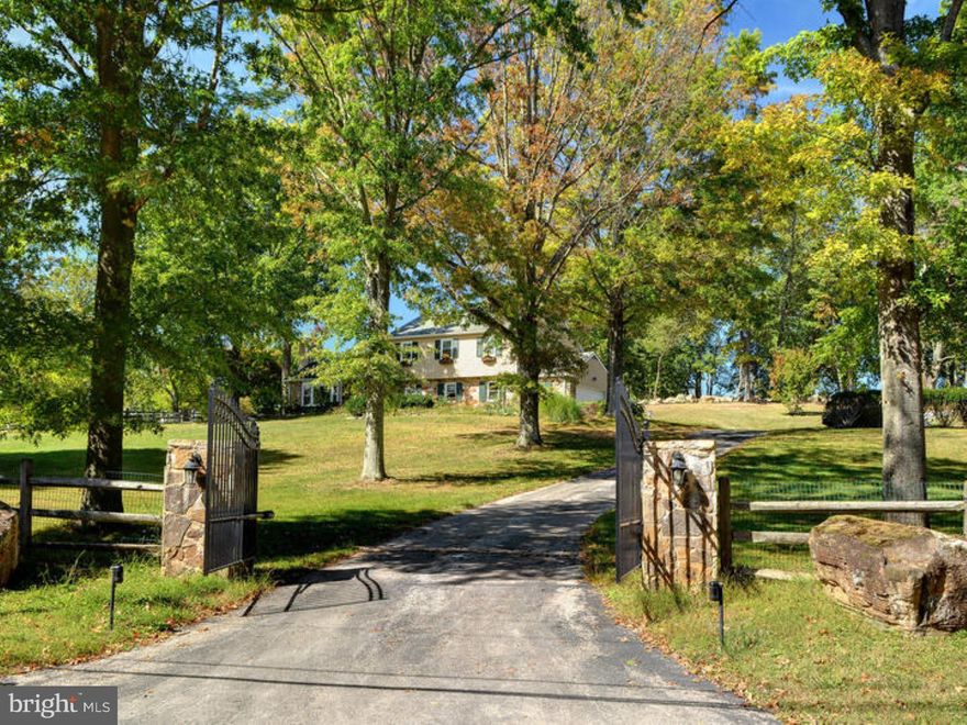 A true Gentleman's Farm in the Heart of Radnor Hunt and spectacular, protected views! Roll out of bed, hop on your mount, and head straight out of your beautiful barn through miles of magnificent Radnor Hunt Trails, straight to the Pony Club, or simply remain on your property and ride on your personal ring. This charming home, located on one of the most revered streets in Malvern, amidst miles of conserved land, sits perched behind a private, gated entrance, and offers magnificent views in every direction. The Main Level features a Living Room with high ceiling and fireplace, Dining Room with French doors opening to the large deck, a Kitchen with granite countertops and views of the property, a step down Family Room with a stone fireplace, a grand Sun Room with access to and views of the grounds, and a Powder Room. Hardwood floors and an open, circular layout throughout. The Second Level offers a Master Bedroom with en suite Bathroom and 2 additional Bedrooms with a sizable Bathroom. The immaculate barn boasts 4 generously sized stalls, a heated tack room, a washroom, and a large 2nd floor with heated office, and separate water and electric. The entire property is fully fenced, offering 4 paddocks, some with water. This is not an opportunity to be missed!