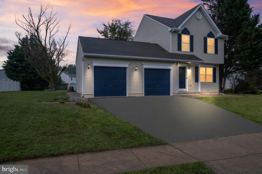 Experience elevated living at 306 E Harvest Lane—an impeccably renovated two-story home in the desirable Appoquinimink school district. Step into an inviting foyer with an updated half bath and new luxury vinyl plank flooring, setting the tone for contemporary style throughout the residence. The newly refreshed eat-in kitchen dazzles with shaker white cabinets, granite countertops, striking glass tile backsplash, high-end stainless steel appliances (including a French Door refrigerator with ice maker), recessed lighting, and a remote-controlled ceiling fan. From here, a sliding door opens to a spacious rear deck and ample backyard, perfect for gatherings and play.

Retreat upstairs to three comfortable bedrooms, including a king-sized master suite featuring vaulted ceilings, recessed lighting, and a private bath with a walk-in shower and sleek floating vanity. Both full bathrooms are fully updated, adorned with matte black finishes and modern vanities. The home’s theme of sophisticated matte black details carries throughout every space.

The versatile partially finished basement offers flexible extra space—ideal for a playroom, home gym, office, or a secluded man cave. The basement also contains a generous laundry room with brand new washer and dryer appliances for convenience and comfort.
Sitting on a large 151 x 136 lot, the property boasts an attached two-car garage with an electric door opener, further enhancing everyday ease. With recent upgrades in paint, flooring, kitchen, lighting, and appliances, this home is move-in ready and embodies exceptional value for anyone seeking top-tier amenities and extra space in a sought-after community.

Schedule your private tour today to take advantage of this rare opportunity—homes in this condition and location don’t last long!