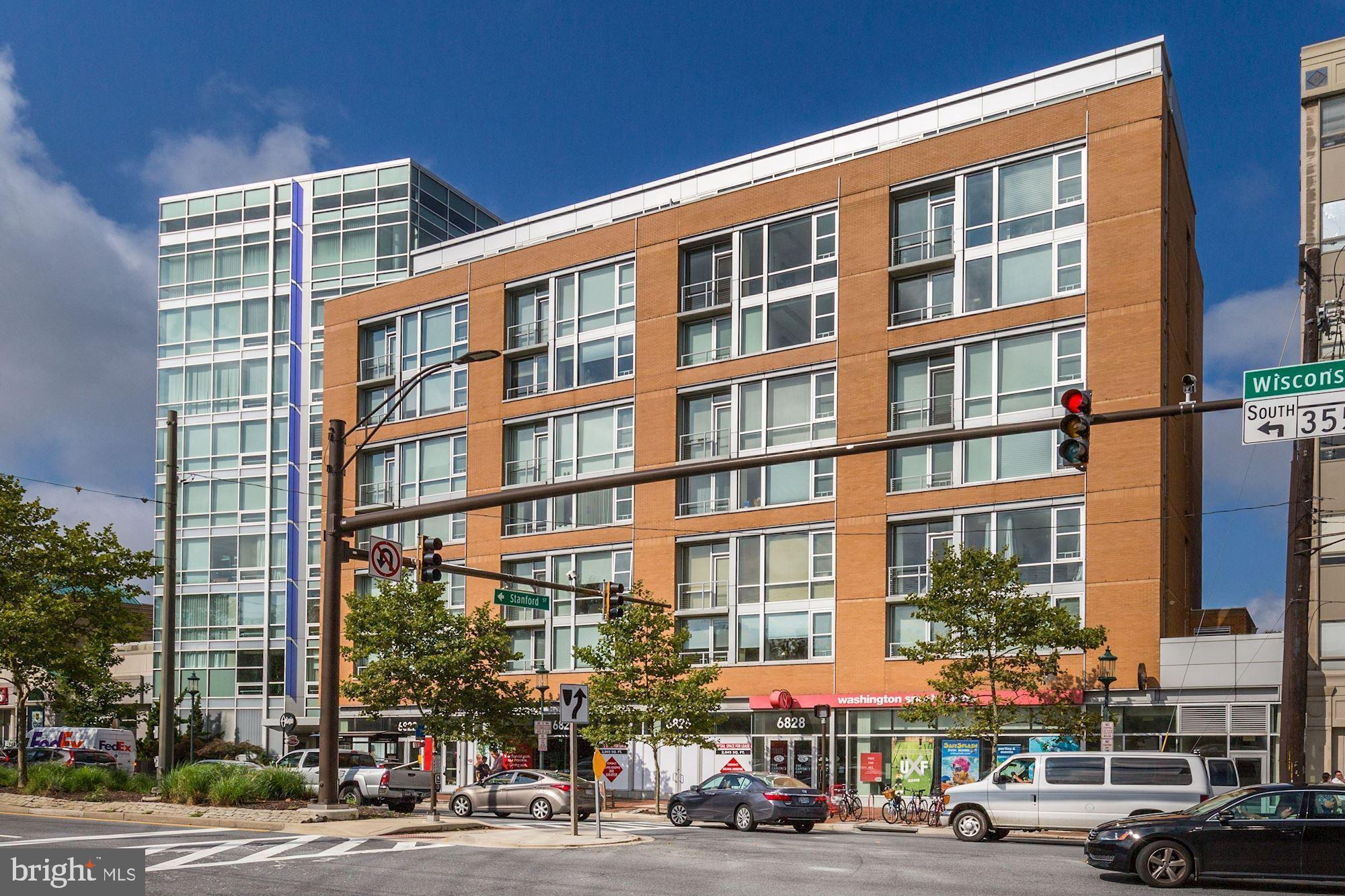 Price Adjusted! Sellers under contract on another property and very motivated. Sensational high-floor corner unit in the prestigious Adagio building steps from downtown Bethesda! Rarely available 1360sf bright 2 bedroom/2 full bathroom with wall to wall windows and TWO separately deeded, side by side, garage parking spaces. The highest in this line and a corner unit, #7005 has windows in every single room, a gas fireplace, juliet balcony, and boasts an open kitchen, living, and dining room concept with fabulous above-the-trees views of Chevy Chase and downtown Bethesda. Huge gourmet kitchen outfitted with Poggenpohl cabinets and the highest end appliances- sub-zero fridge, wolf oven, bosch stove, miele dishwasher. Hardwood and marble floors throughout with an abundance of custom built closet space throughout the entire unit. Rooftop terrace, state of the art fitness center, guest suite, social room, library, 24 hour concierge, and unlimited, free, underground guest parking complete this chic downtown Bethesda living package. Call listing agent Diana to show.