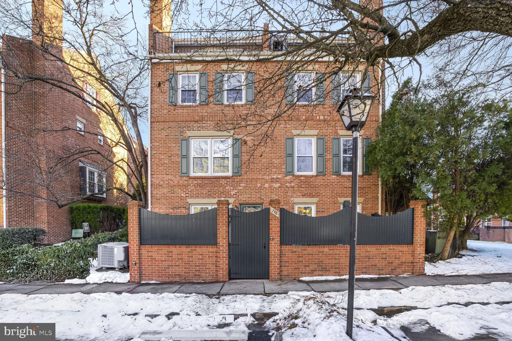 Welcome to 748 N. Vermont Street, a beautifully renovated 2-bedroom, 2-bathroom condo in the desirable Ballston Mews community in North Arlington. This charming home combines traditional floor plan features with modern updates, offering spacious, light-filled interiors and thoughtful design. Located in a quiet, low-rise setting, this condo eliminates the hassles of high-rise living, with an assigned parking space just steps from your front door.

The home has been freshly painted in January 2025 with a neutral, welcoming color that flows throughout. Large windows in every room allow for an abundance of natural light, creating a bright, airy atmosphere. The living and dining rooms feature gorgeous hardwood floors, crown molding, and new blinds (2025), while a cozy fireplace mantle adds charm. The large bay window in the dining room provides a perfect spot for a reading nook.

The kitchen is a true highlight, featuring modern Shaker-style cabinets (2018), Quartz countertops (2018), and a chic subway tile backsplash in a herringbone pattern (2018). Stainless steel appliances, including a new dishwasher (2024), complete the space. A standout feature of this condo is the massive walk-in pantry—unmatched in size for a condo, offering exceptional storage space. Under-cabinet lighting and a spacious layout make it perfect for home chefs and entertainers.

Both bedrooms are generously sized and offer a peaceful retreat. The primary bedroom, with brand new engineered hardwood floors (January 2025), features large windows, a sizable closet, and custom blackout shades (2019) for restful nights. The en suite primary bathroom boasts a custom navy vanity (2018), Quartz countertops (2018), and floor-to-ceiling makeup cabinets, offering style and functionality. The separate shower/toilet area adds privacy.

The second bedroom, also updated with new engineered hardwood floors (2025), includes a cozy nook ideal for a home office. A large window, custom blackout shades (2019), and ample closet space make this room spacious enough for a king-sized bed. The second full bathroom features a white vanity (2018), Quartz countertops (2018), and a new toilet (January 2025), along with a tub/shower combo.

Storage is abundant, with a coat closet, two hallway storage closets, and a dedicated laundry room with shelving. The laundry room also houses the new hot water heater (2024).

Step outside to your private patio—a rare luxury in condo living—perfect for outdoor entertaining or relaxation. The patio is enclosed with a new privacy fence (installed by the HOA) and has freshly power-washed brickwork (January 2025), making it an ideal space for unwinding after a long day.

The condo fee is low and includes water, sewage, trash and recycling pickup, landscaping, snow removal, and access to a well-maintained courtyard. One assigned parking space, guest parking, and other amenities make this community a true gem.

The condo community has undergone several significant improvements, including new roofs (2023), a completely repaved parking lot (2024), and new fences and gates (2024). Exterior painting is the next planned upgrade, ensuring the community remains in top condition for years to come.

The location is unbeatable, with vibrant Ballston just a short walk away, offering a variety of dining, shopping, and entertainment options. Ballston Quarter features a food hall, movie theater, and outdoor dining spaces. You'll also find Target, grocery stores, gyms, and the newly renovated Lubber Run Community Center, which offers pickleball courts, basketball courts, and a playground. Arlington’s famous biking and hiking trails, including the WO&D Trail, are nearby, and the Ballston Metro station is less than a 10-minute walk, offering easy access to the greater DC area.

With its thoughtful updates, abundant storage, and prime location, 748 N. Vermont Street is the perfect place to call home. Come see for yourself all that this exceptional condo has to offer!