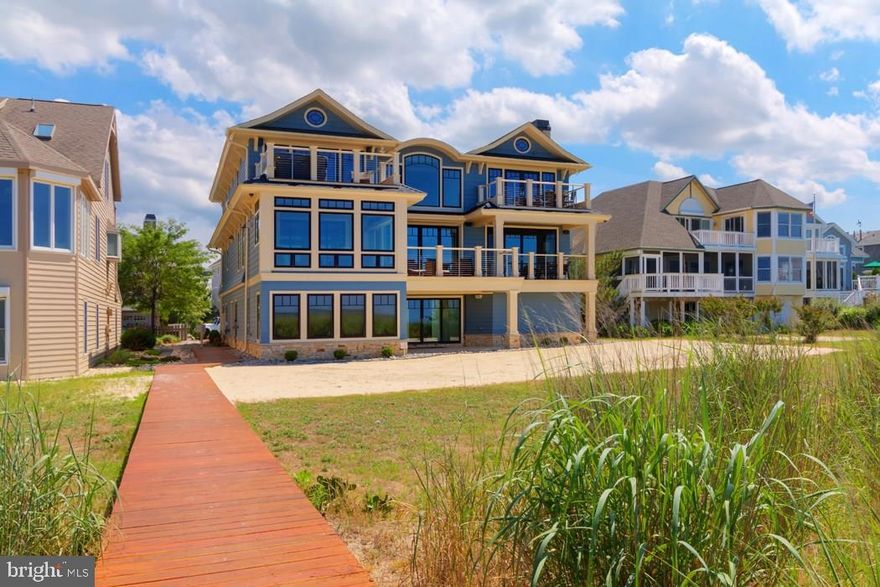 BREATHTAKING COASTAL UTOPIA - The pinnacle of relaxation & architectural design welcomes you to the beach! Wide-open glistening water views, luxury appointments in every room, and plenty of open-air deck space complete with built-in outdoor grill & fireplace - mere steps to the sand & your own, private boardwalk ? let you soak in sunshine where the Delaware Bay meets the Atlantic Ocean. Enthralling ?smart? home is entirely remote-controlled from your phone. 3 floors of architectural nuances & extensive attention to detail deliver picture perfect views. From the 2nd level with its generous gourmet kitchen & comfortable, elegant living space; to the fully finished 1st floor with game room, beautiful bar/living area & gym; to the private 3rd floor with 2 bedrooms on one side & the master suite on the other featuring luxurious bath, bay front balcony with hot tub, & enviable walk-in closet! The best views are reserved for you, courtesy of this unmatched home by the sea!