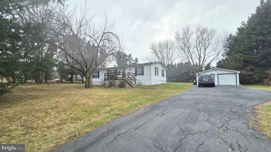 Don't miss this unique opportunity for a large, double wide ranch style home,  on over an acre that you will own!  No lot rent, no park fees.  Mature trees surround beautiful front and back yards.  Detached 2 car garage with storage space.