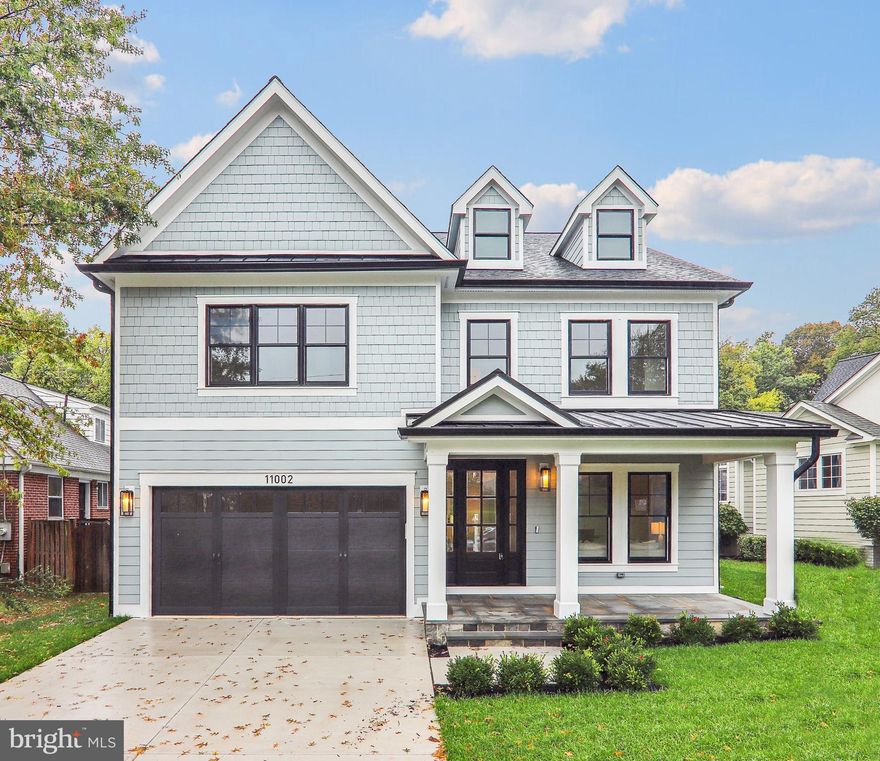 Welcome to 11002 Stillwater Avenue,  one of two available homes on this street - built by esteemed builder, ERB Properties! This extraordinary home offers an amazing open floor plan with 3 finished levels, 5 bedrooms, 4.5 bathrooms and over 5,000 square feet of living space! Featuring beautiful craftsmanship and finishes with generous-sized rooms, abundant recessed lighting and wide plank hardwood floors, it is ready for you to move right in! The main level includes a living room, formal dining room, gourmet chef’s kitchen with high end appliances, soft close cabinets & drawers, quartz countertops, island with waterfall counter and a walk-in pantry. The main level also features a light and bright family room with a gas fireplace, a large mudroom with cubbies and a bench and a powder room. The spectacular upper level boasts a primary suite with a walk-in closet and a luxurious spa bathroom with a separate oversized frameless glass enclosed shower with dual showerheads, a soaking tub and two sinks. Also on the upper level are 3 additional bedrooms, 2 additional full bathrooms, a lovely, open family/homework-study area and a laundry room with a washer and dryer. On the spacious lower level you will find a recreation room with a wet bar and beverage refrigerator, a 5th bedroom, a 4th full bathroom, an exercise room with rubber mat and mirror, additional storage space and a separate walk up side entrance. Additional features include an attached two car garage and a covered rear patio! Located in the lovely Garrett Park Estates subdivision, this home is part of the Walter Johnson High School cluster.