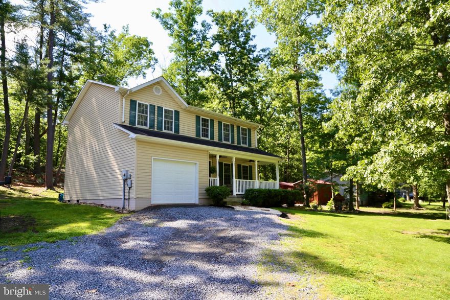 *BACK TO ACTIVE - NO FAULT TO SELLER and/or PROPERTY. 
***PRICE REDUCED! Nestled on 2 peaceful acres near Capon Bridge and Route 50, this meticulously maintained 3-bedroom, 2.5-bath home offers both comfort and style. Featuring refinished hardwood floors (2022) and new carpet, the interior exudes warmth and elegance. High Speed Fiber Optic Internet Available! The kitchen boasts newer appliances, a farmhouse sink, and sleek quartz countertops & backsplash. Generous walk-in closets provide ample storage. The property includes two 10x20 outbuildings and a 1-car garage, perfect for additional storage or hobbies. Have a camp fire out back and enjoy the sounds of the water rushing through the Mill Branch Stream. 1500 gallon septic tank was just pumped (May 2024). Don’t miss the opportunity to own this beautiful, move-in-ready home! Less than 25 minutes to Winchester, VA. Less than 2 1/2 from D.C. Schedule today!